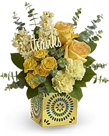 Teleflora's Shimmer of Thanks - Show your appreciation in a most stylish way with this sunny bouquet of yellow roses, stock and carnations! The happy bouquet is hand-delivered in a shimmering golden cube with delicate cutouts. Remove the teal liner and "thanks" and the cube becomes a contemporary candleholder.  