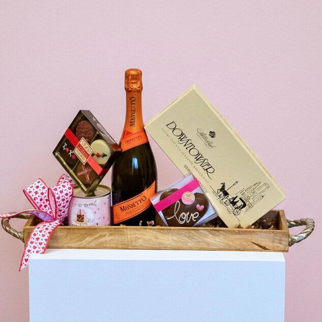 Sparkling Love Gourmet Basket - GOURMET BASKET COLLECTION | LOCAL DELIVERY ONLY  A sweet and stylish gift for Valentine's Day featuring bubbly, decadent chocolates, and cake mix presented on a chic wooden tray. Perfect for a cozy night in and something sweet to share.  Please note: Recipient must be 21 years or older and present a valid ID at time of delivery. 