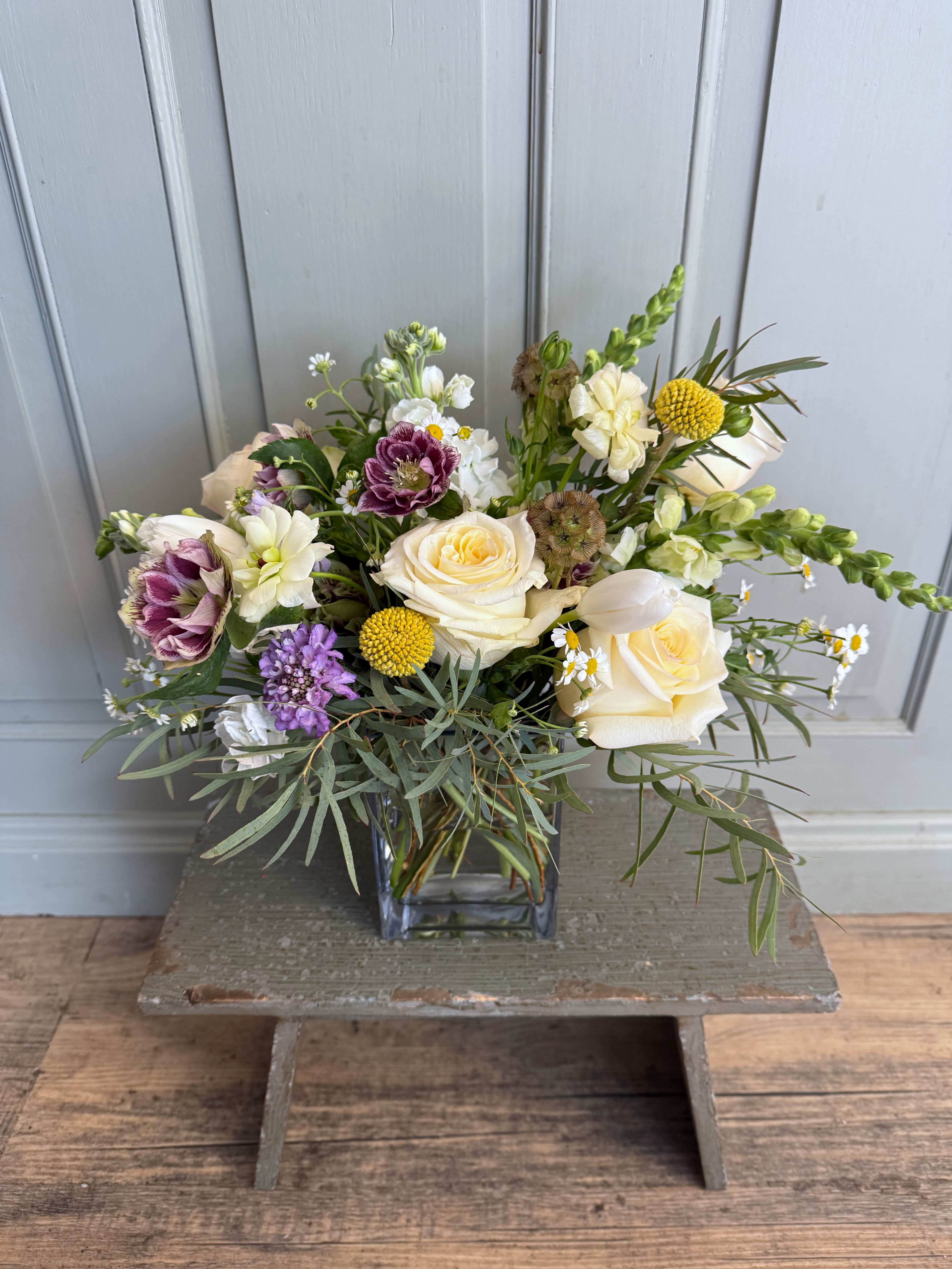 The Hilary - Meet the Hilary.. a flowy arrangement with the freshest florals with a splash of color. Arranged medium height.