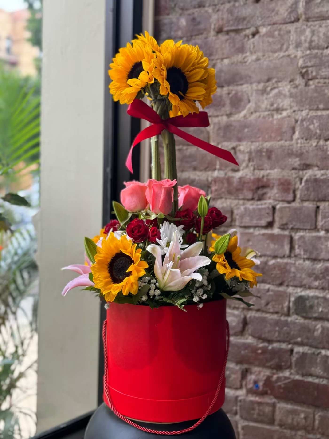 Enchanted Garden - Sunflower arrangement with lilies for any occasion.