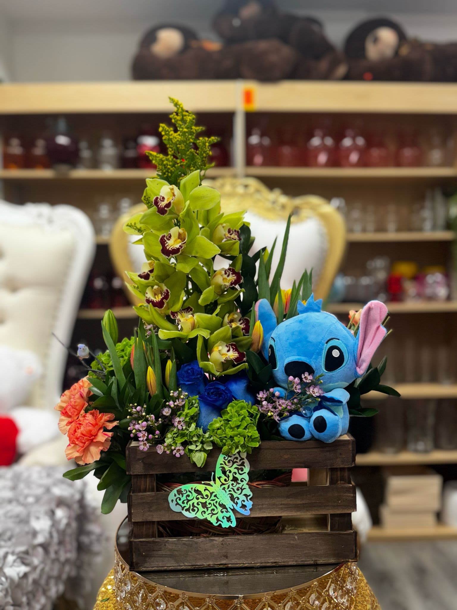 Pure Magic - Tulip arrangements accompanied by a large Orchid, and a small Stitch