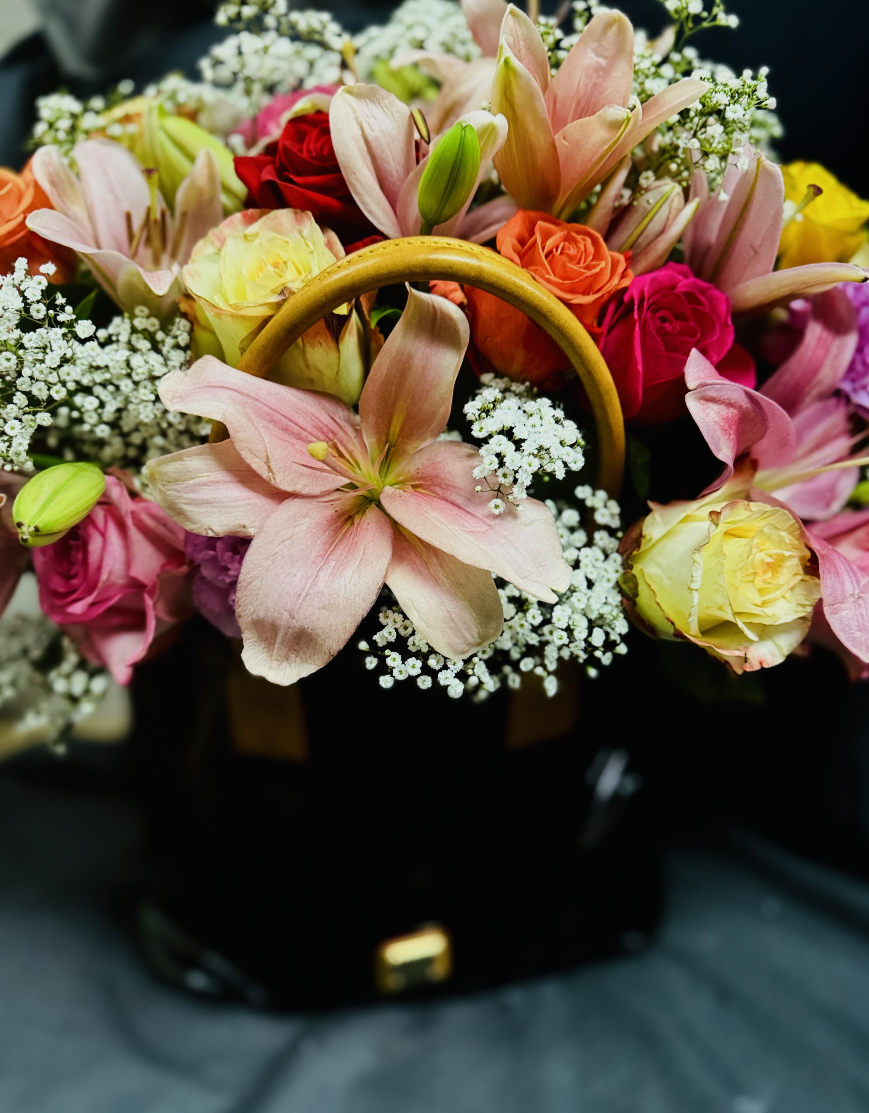 Pocket Full of Posies - A trendy, stylish,  flower display arranged in a gift!!   The gift of flowers, designed and arranged in the gift every lady LOVES!!  Flowers are delivered in a pre loved designer purse.  Surprise her in more ways than one with flowers to enjoy then a purse to use and enjoy for days to come!   *** PURSE DESIGN AND BRAND WILL VARY !!!***