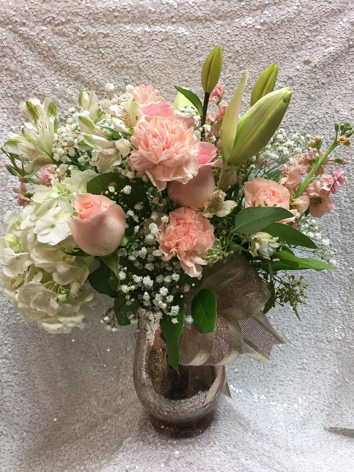 Sweetener - Simple and sweet floral arrangement full of roses, lilies and hydrangeas. 