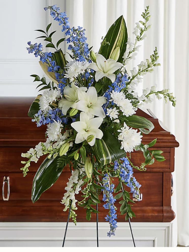 Forever Loved - Serving as a timeless tribute to honor and celebrate the life of a loved one, this exquisite standing spray features a combination of soft florals symbolic of everlasting love. Details Standard Spray is approximately 38"H x 18"W. Designed by florists, ready to display. Pet Safety Precautions: This bouquet or plant may include flowers and foliage that are known to be toxic to pets. To keep them safe, be sure to keep this arrangement out of your pet's reach. Bloom Details Snapdragon Lily Delphinium