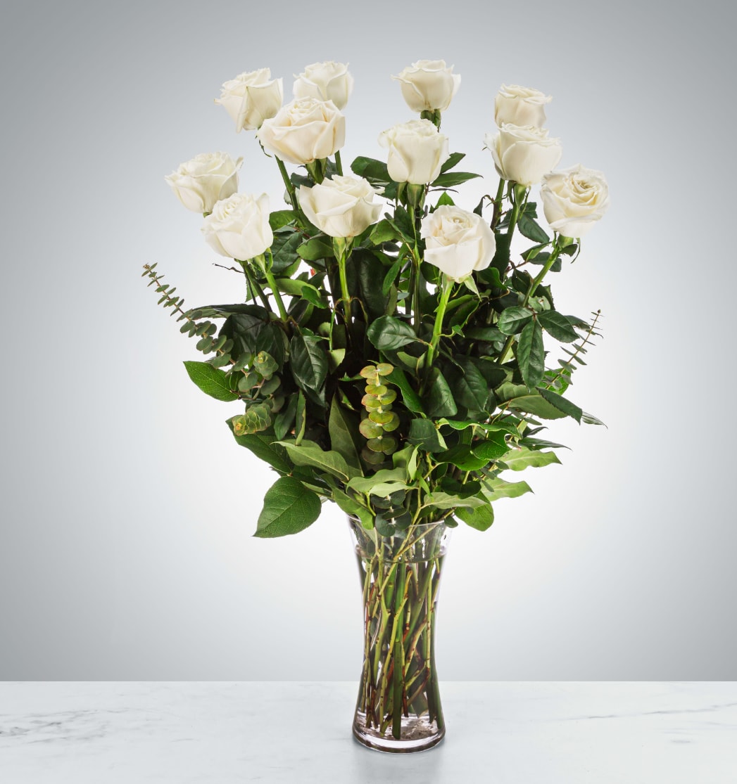 Dozen Long Stemmed White Roses  - A dozen white roses are a classic gift! Perfect for Valentine's Day, an Anniversary, or any type of celebration.  Approximate Dimensions: 20"D x 30"H