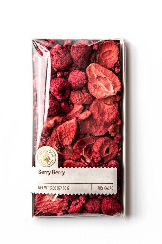 Berry Berry Chocolate Bar - Even more striking than the beauty of this bar is the balance of its tart and natural sweetness brought forward by hand-placed freeze dried strawberries and raspberries on top of rich 70% dark chocolate.  Why say "I love you" with flowers, when you can say it with a bouquet of red strawberries and raspberries on delicious dark chocolate?  The Berry Berry bar is perfect for any occasion.   85 grams.