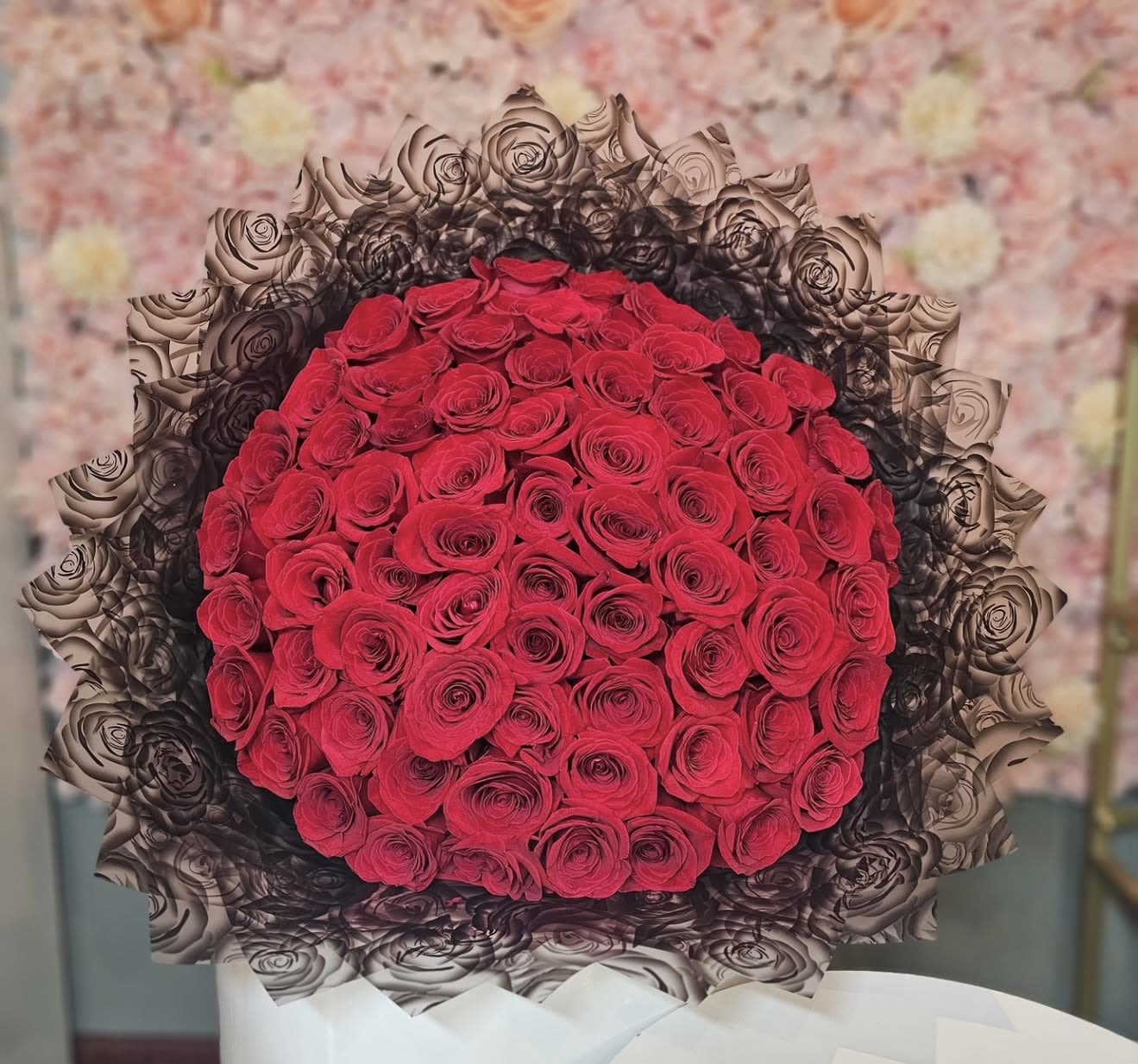 Amore Mio Buchon - This is all you need to make that special person fall in love. Surprise she or he with an elegant all red roses bouquet. Our hand-tied bouquets are delicately arranged combining pure Ecuadorian roses. You can choose from 50 - 100 (or more).   50 to 100 Red Ecuadorean Roses ( rose ct depends on size selected.) Wrapped in Black paper giving the perfect touch of elegance.  “NOTICE”  We are dedicated to delivering your emotional sentiments with the utmost care, ensuring that each arrangement is fresh, beautiful, and arrives on time. Due to the natural variability of flowers, as well as seasonal and regional availability, substitutions may occasionally be necessary. Rest assured, any substitutions will be of equal or greater value, and we will make every effort to preserve the overall design, including the shape, size, style, and color combinations of the arrangement. In the case of single-variety arrangements, the specific variety will take precedence over color to maintain the intended look and feel. Thank you in advance for understanding that flowers are a natural product and may vary slightly in appearance.