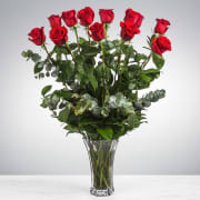 Dozen Long Stemmed Red Roses by BloomNation™ - These dozen red roses are the classic romantic gift! Perfect for Valentine's Day or an Anniversary.   APPROXIMATE DIMENSIONS: 25" H X 18" W