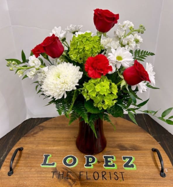 XOXO - A red glass vase filled with fresh hydrangea, carnations, roses, tulips, the perfect Valentines gift