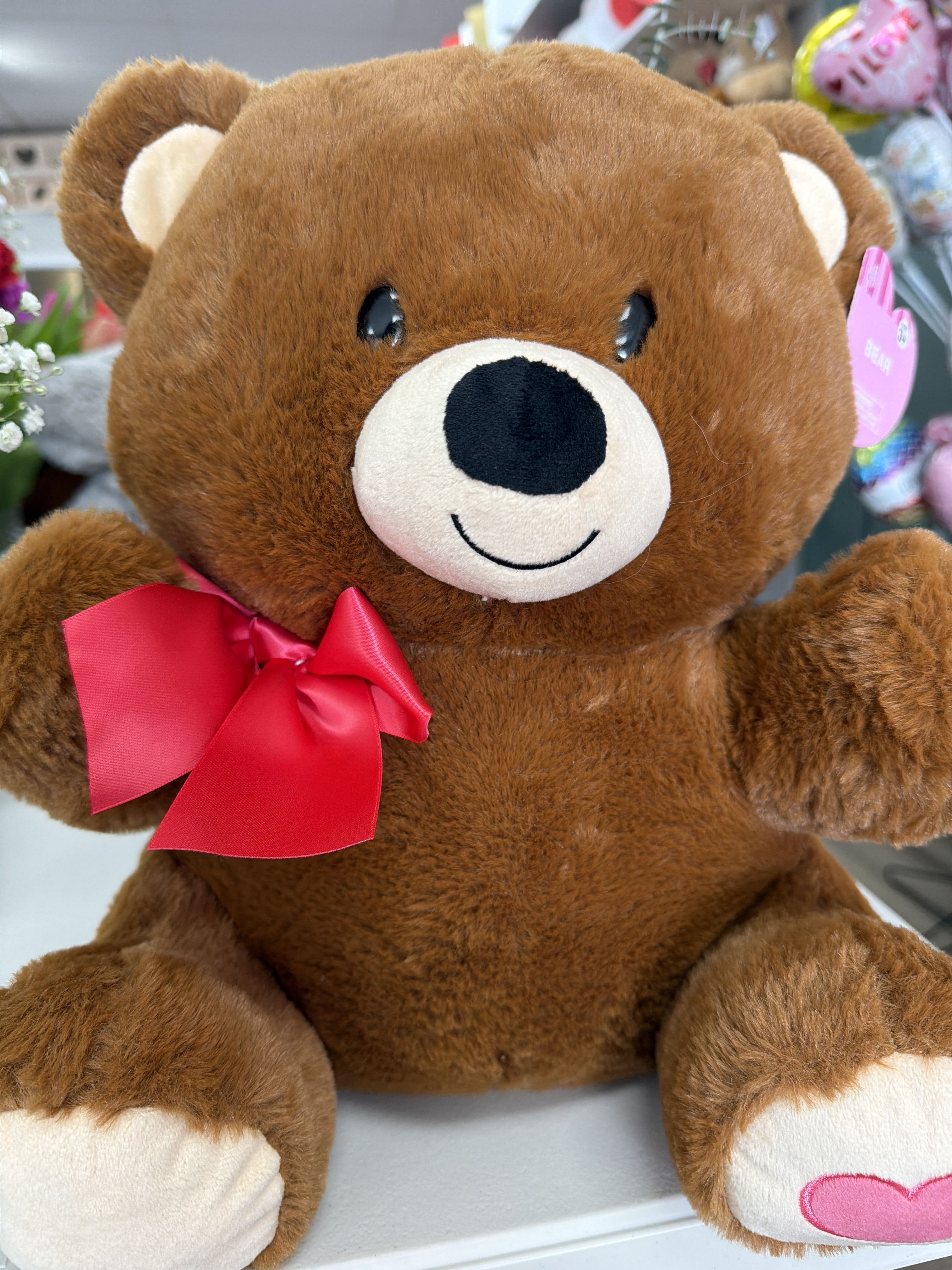 Teddy bear - A soft and cuddly teddy bear made to bring comfort, warmth, and smiles. This timeless plush companion is perfect for pairing with flowers, chocolates, or gift baskets, making any gesture extra special