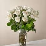 White Roses - White roses are elegant, luminous, and beautifully accent any room. Remember, some flowers or containers may be substituted depending on current availability.