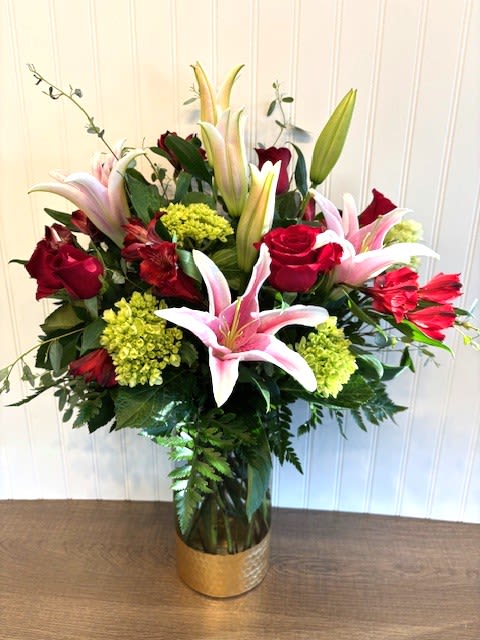 Enchanted Garden - A luxurious design of roses, lilies, hydrangea and other flowers from the garden that will fill their day with beauty and magic.