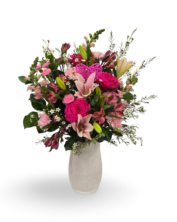 My Valentine - My Valentine is a romantic floral arrangement filled with soft, seasonal blooms and lush greenery, designed to feel timeless and heartfelt. A beautiful way to send love and warmth in one elegant piece. Approximately 23 × 14 inches.