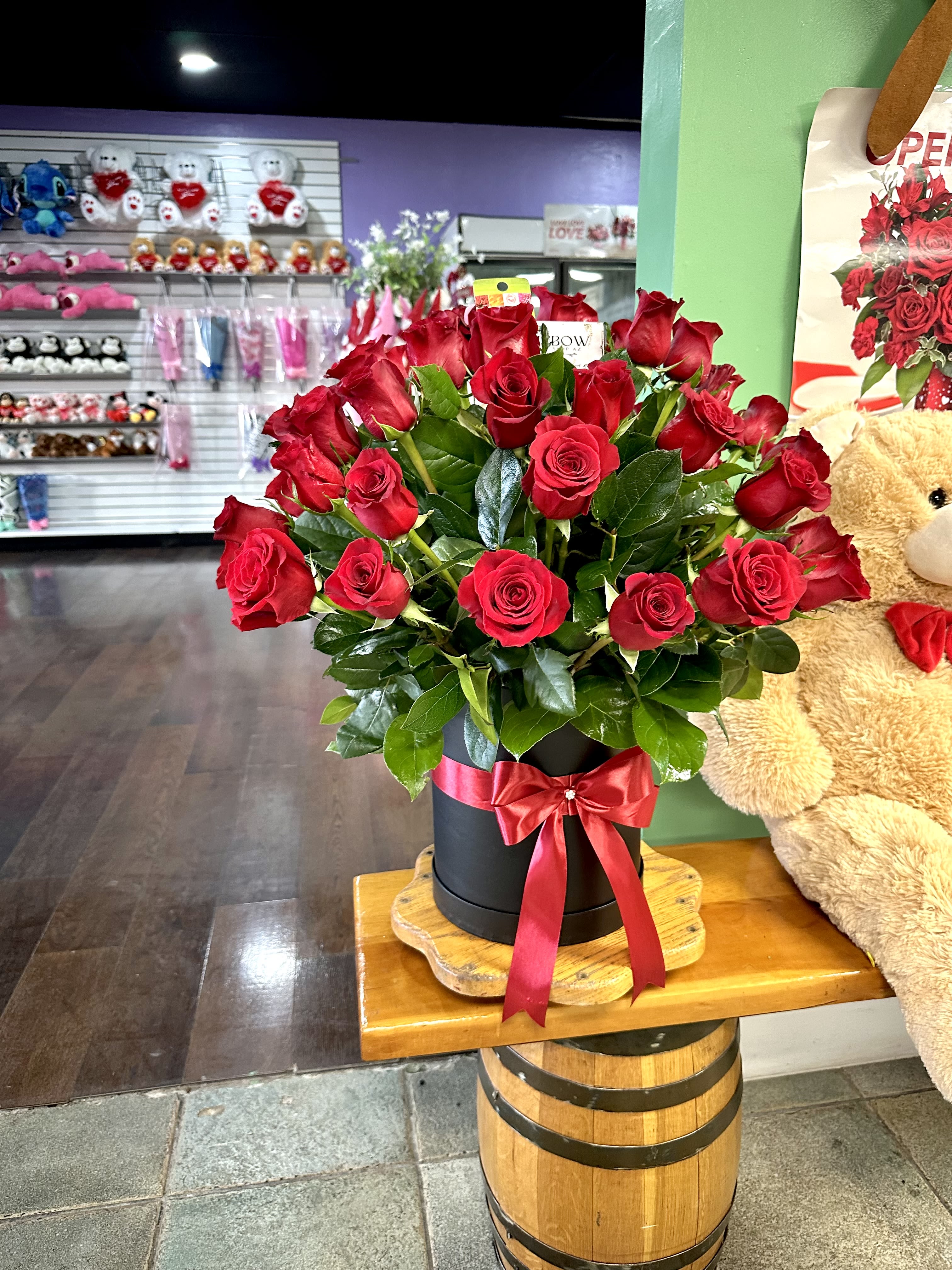 Fantastic 50 Roses - Express your love with fifty long-stem roses with greens and a red bow