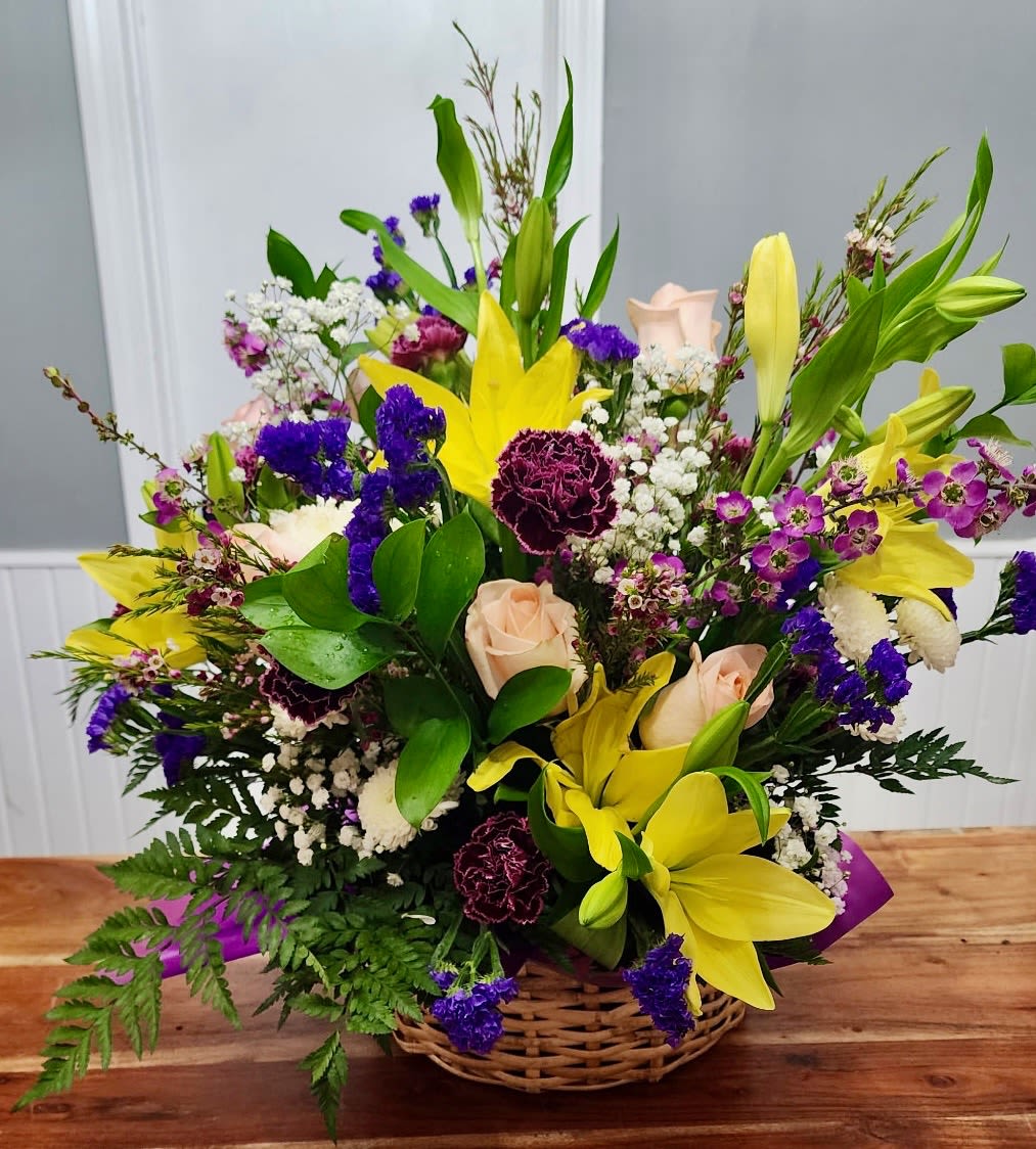 Peach Passion - Peach roses with yellow lillies in and charming basket