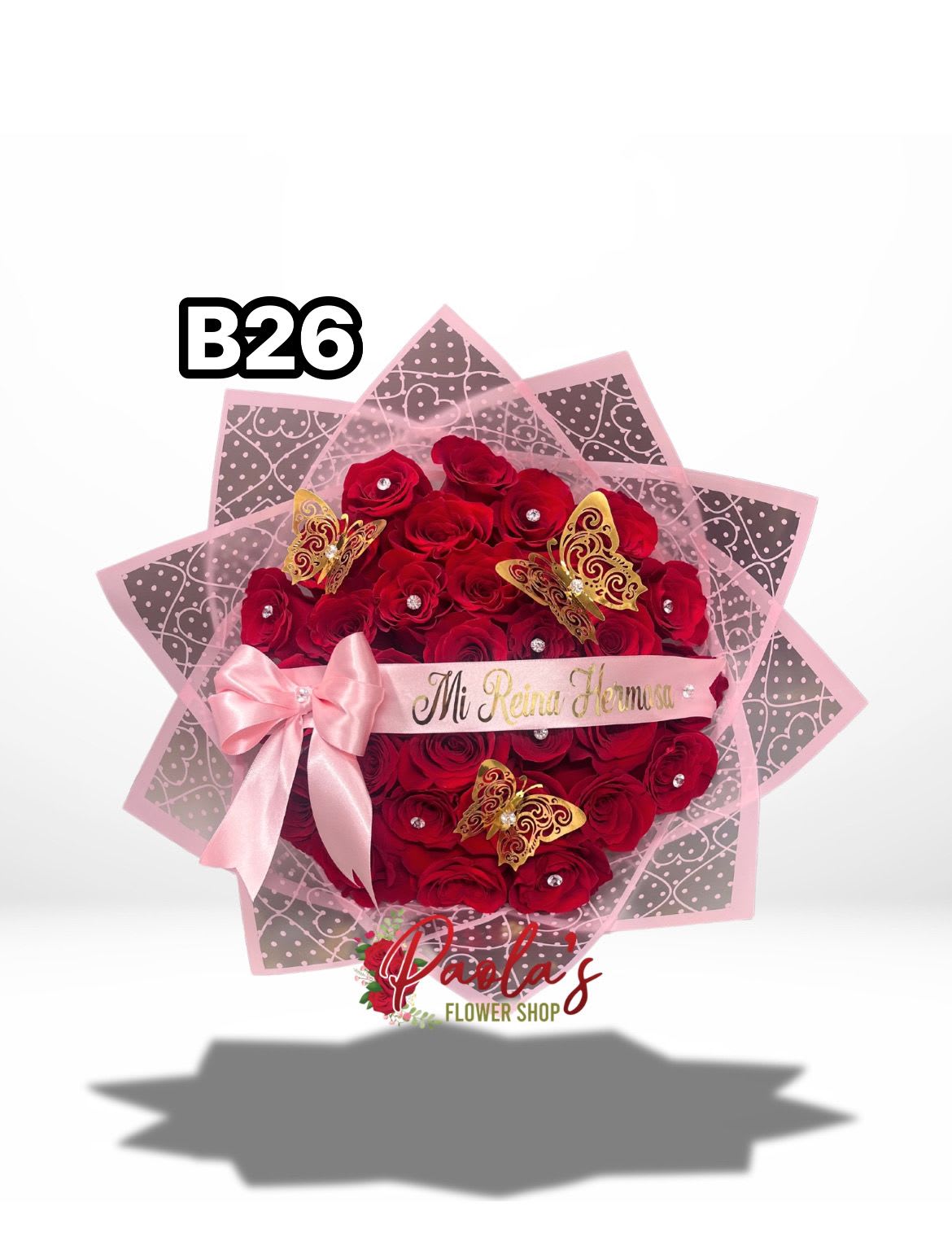 Mi Reina Hermosa – Buchon - Make a bold statement of love with our Mi Reina Hermosa Buchón, a stunning arrangement of 36 premium long-stem red roses expertly styled in the iconic Buchón design. This lush, oversized presentation features tightly arranged roses wrapped in elegant layers, accented with delicate decorative details for a truly luxurious finish.  Perfect for Valentine’s Day, anniversaries, birthdays, or simply to remind her she’s your queen. This arrangement is designed to impress, turning a classic rose bouquet into an unforgettable expression of passion, romance, and admiration.