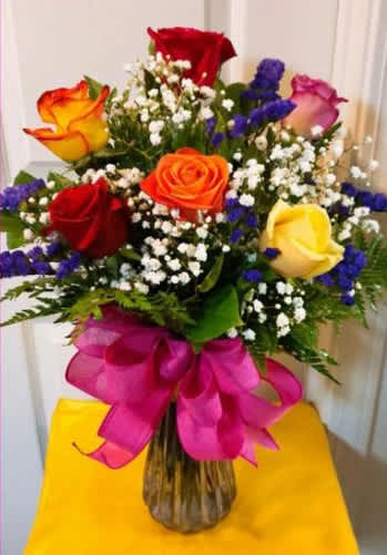 Rose Elegance- Assorted Roses - Our exquisite bouquet of magnificent, long-stem assorted roses, hand-crafted by our expert florists, complements any occasion with unforgettable style. Because only the freshest roses are selected for this arrangement, actual rose colors will vary due to local availability. Premium long-stem assorted roses, artistically arranged by our florists with fresh gypsophila in a classic glass vase; rose colors will vary Available in bouquets of 1 dozen and 18 stems and 24 stem arrangement measures approximately 24"H x 16"L 12-stem arrangement measures approximately 22"H x 15"L Vase measures 11"H Our florists hand-design each arrangement, so colors, varieties, and container may vary due to local availability