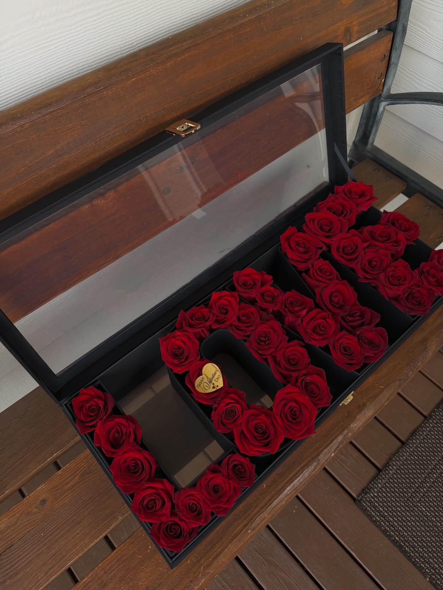 LOVE  - LOVE Rose Box — red roses arranged in the word LOVE inside an elegant black gift box. Perfect for a romantic, luxury gift.