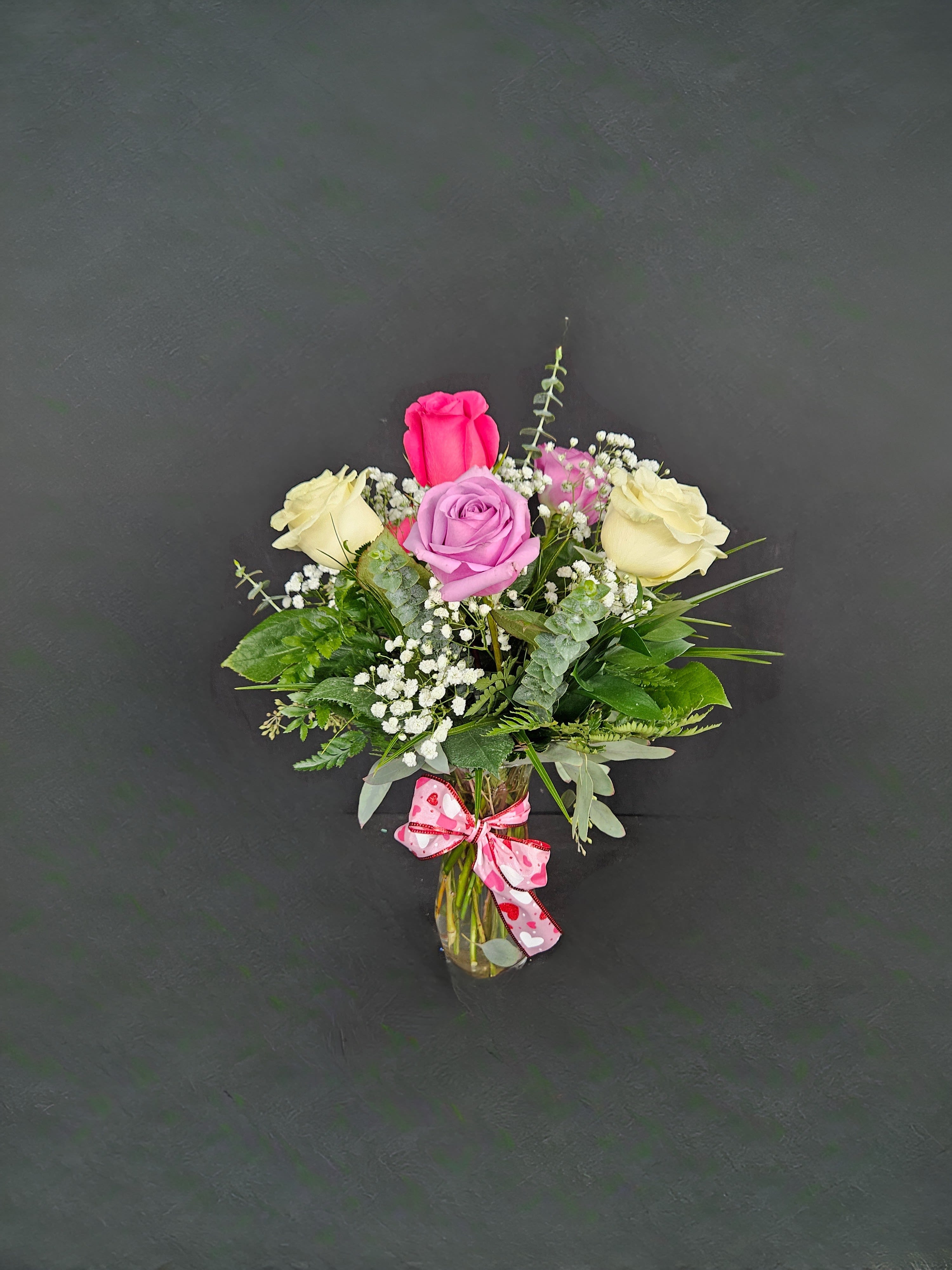1/2 Dozen Assorted Color Roses - 6 beautiful assorted color roses arranged in a vase with baby's breath and greens (colors will vary).