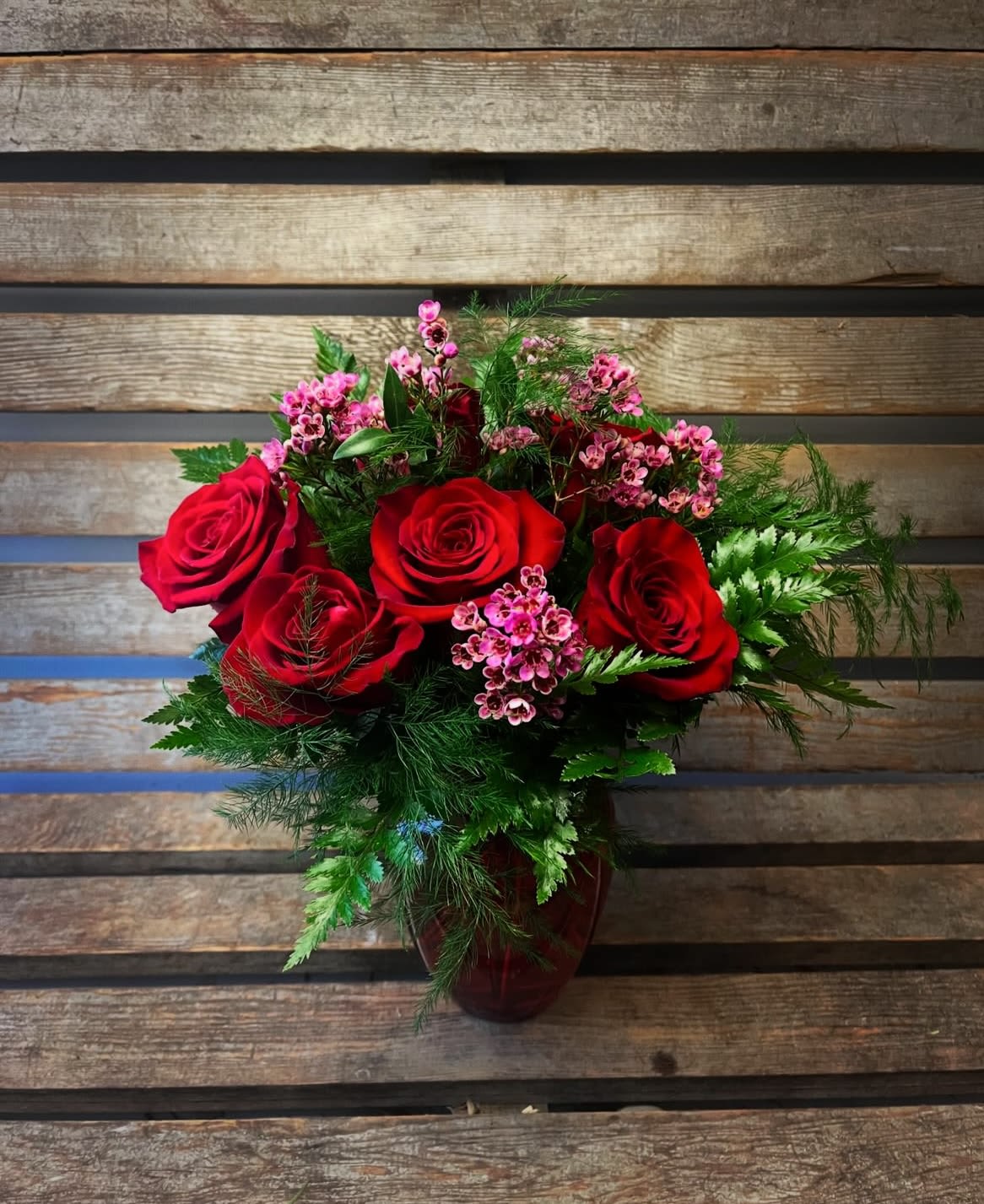 1/2 dozen short red roses in red vase  - 1/2 dozen red roses in red glass vase. Perfect for a new Valentine. 
