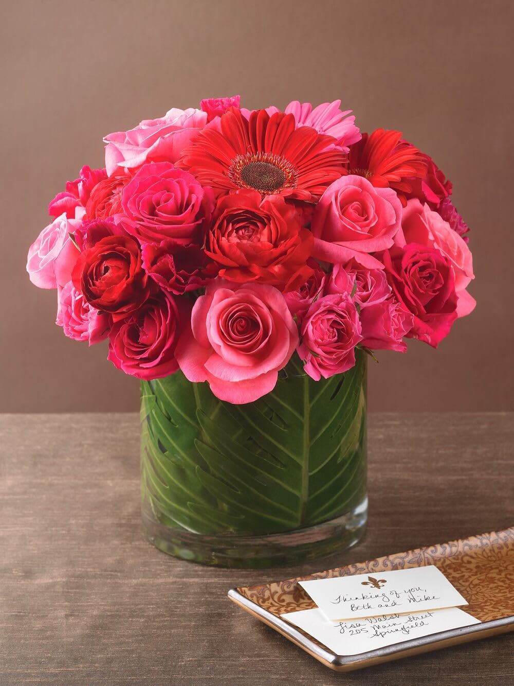 Fresh Daisy in Pink with Luxe Gift Wrap and Personalized Gift Card - Meet the Fresh Daisy bouquet—a joyful departure from the ordinary. Brimming with fluffy, spirited gerbera daisies, its happiness unfolds from every angle. Accented with classic roses and fresh greens, this vibrant design blossoms in a playful mix of pink and red.