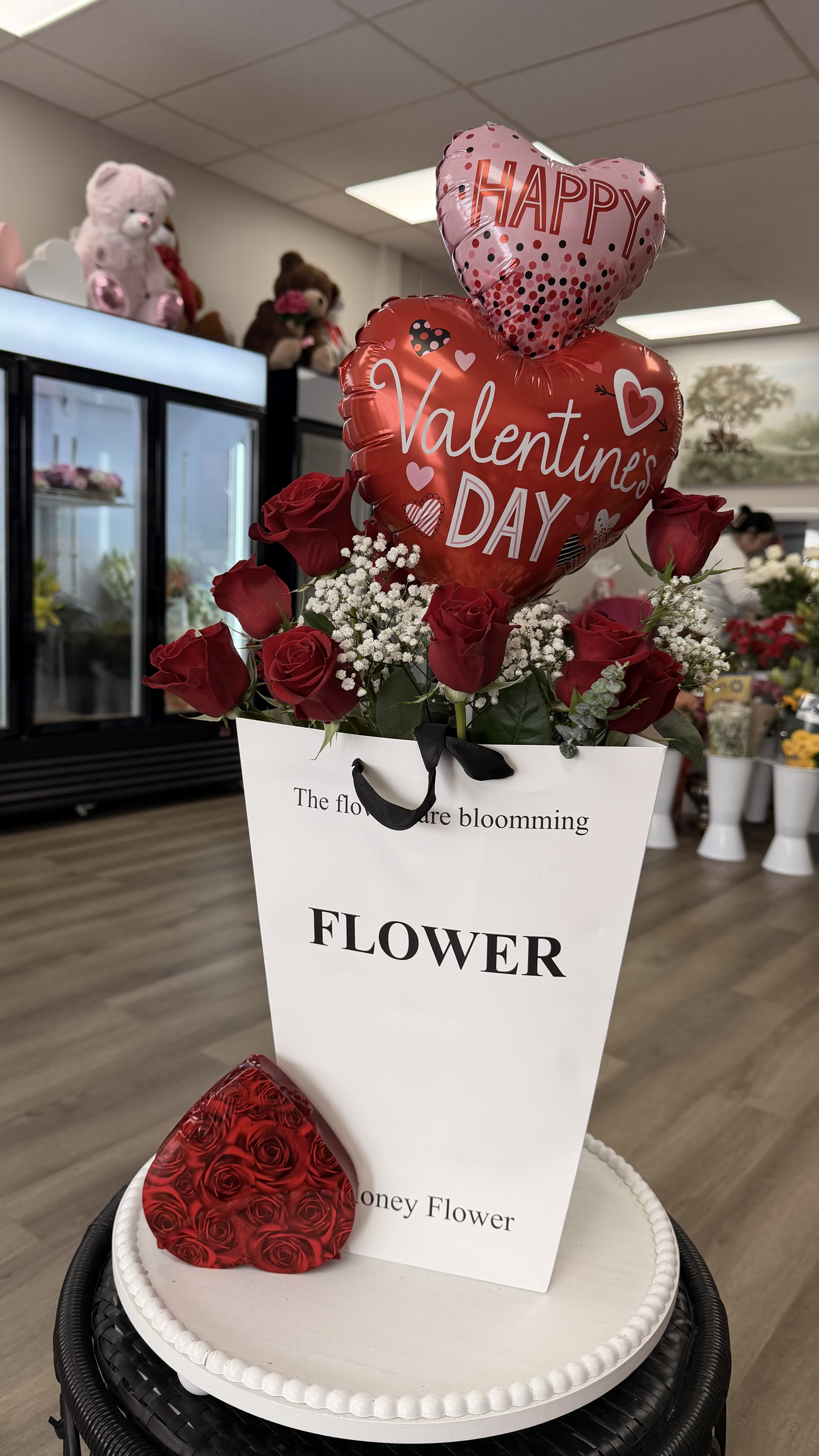 	Be Mine Roses &amp; Balloons - A stunning Valentine’s Day arrangement featuring fresh red roses, delicate baby’s breath, and festive heart-shaped balloons, beautifully presented in a modern keepsake bag. A sweet and elegant way to say Happy Valentine’s Day.