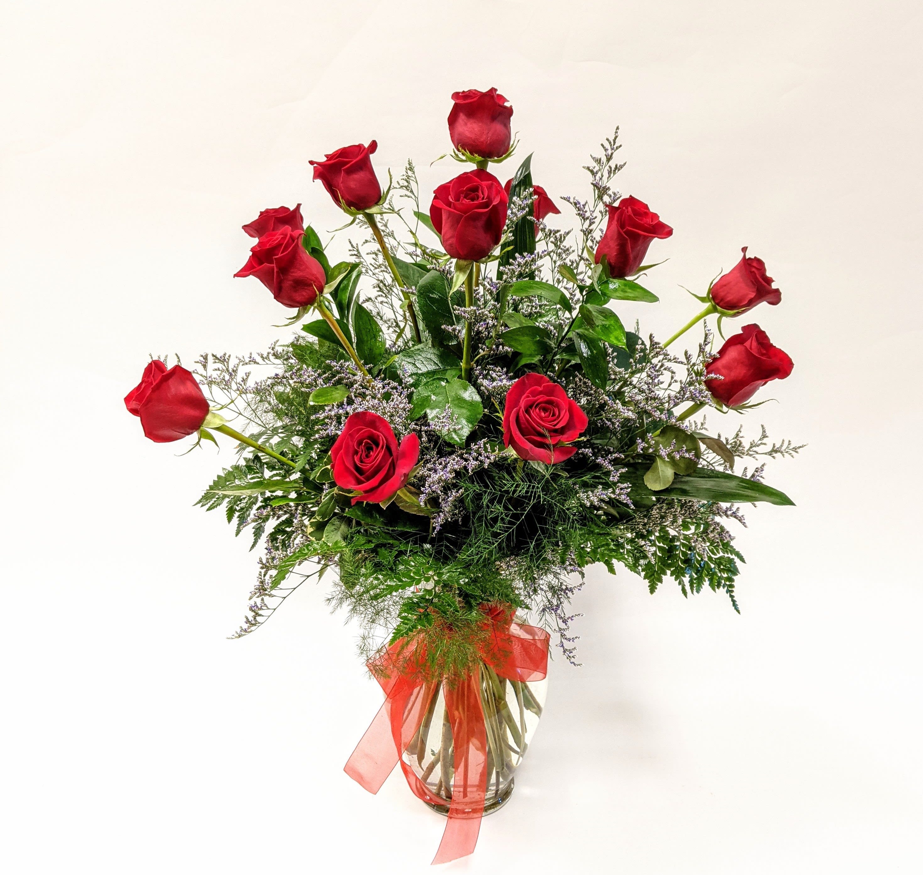 The Perfect Dozen - A dozen red roses are always perfect, always savored. Styled with our unique greens and stunning filler, this rose arrangement is the perfect way to say "I Love you".