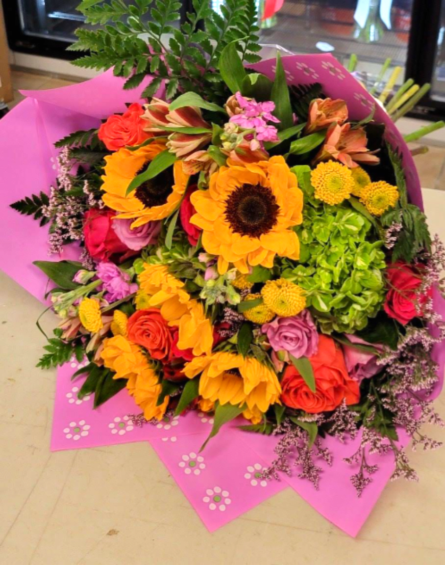 Mixed Color Wrapped Bouquet - Gorgeous mixed seasonal flowers with greenery in a wrapped bouquet  