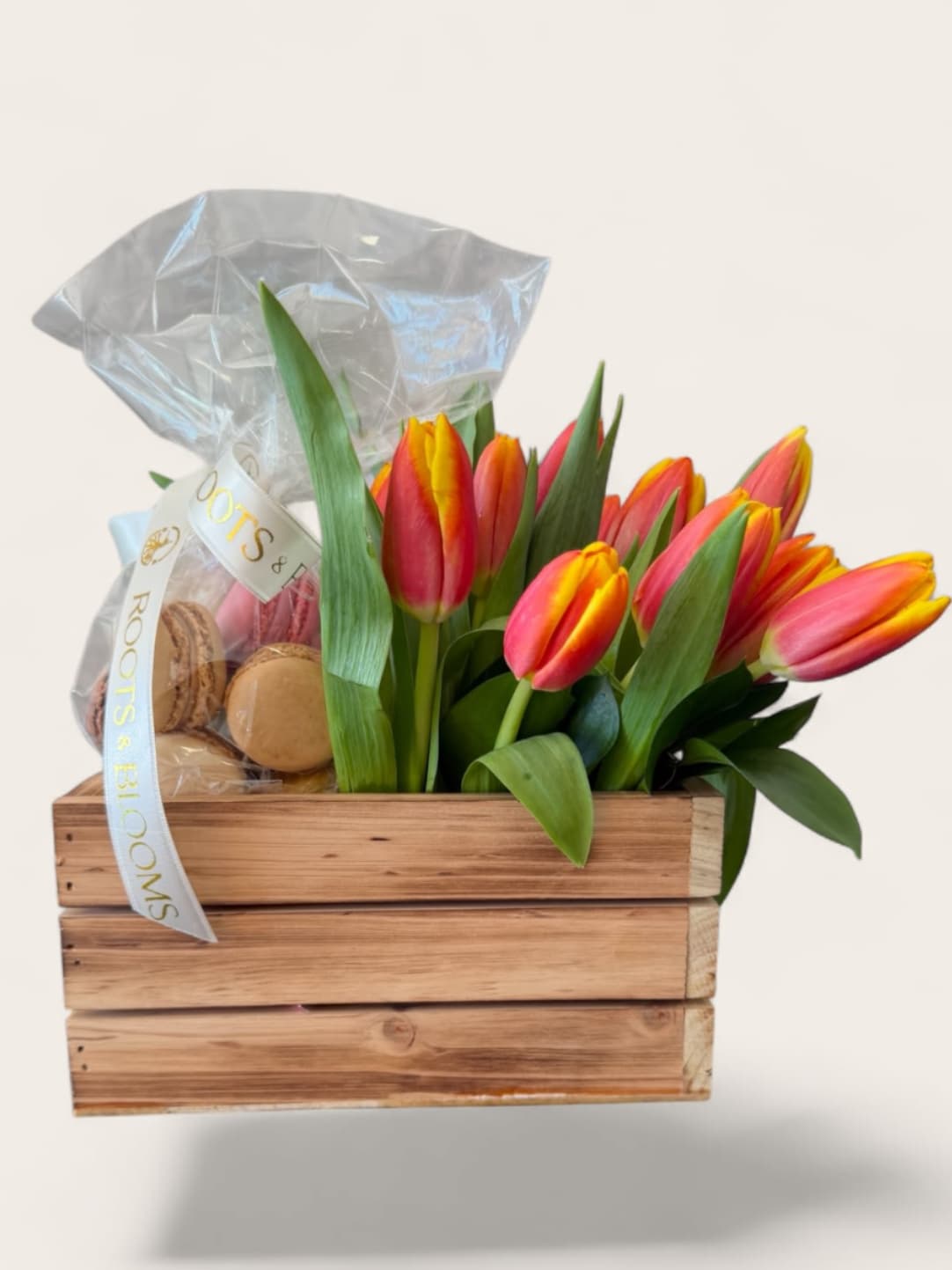 Tulips and treats  - A charming wooden box filled with vibrant, tulips and artisanal macaroons -perfect celebrating life’s simple, beautiful moments. 