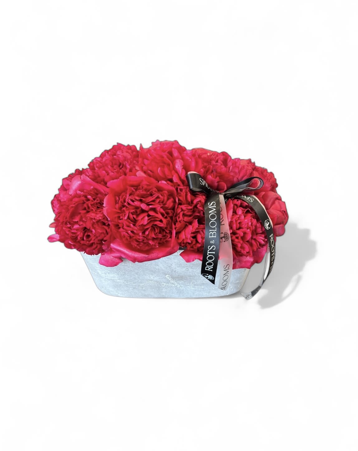 Paradise  - A peony paradise arrangement, highlighting their lush, mul-ti-petaled blooms and vibrant color.