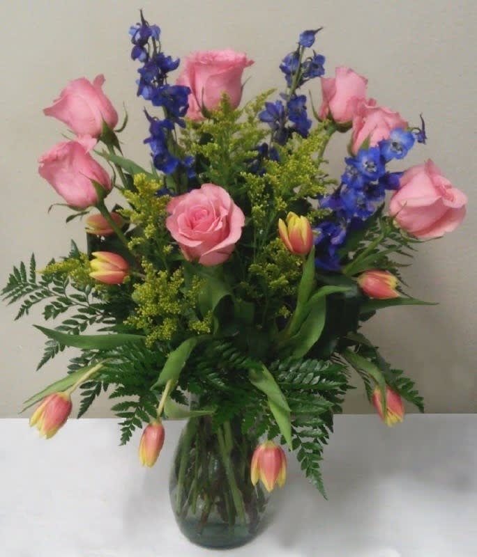 Tulips with Roses and Delphenium  - Pink Roses are featured with Tulips, Blue Delphinium with Solidago and Greens. *Deluxe Shown  