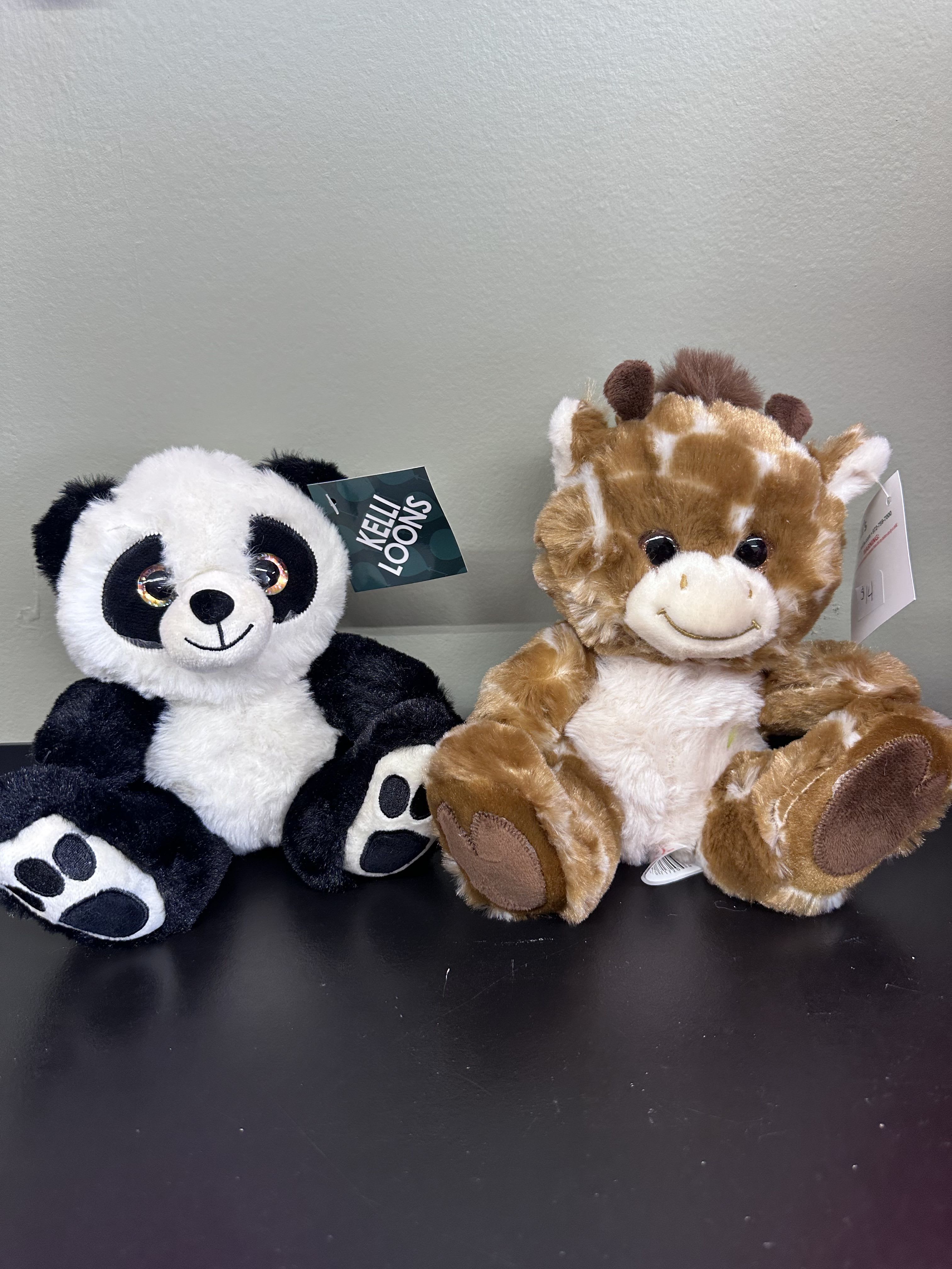 Footsie Plush Animals - Super soft and cuddly! Panda and giraffe footsies are a wonderful option for all age ranges. Option between panda and giraffe is dependent on availability.  Measures 7.5 inches tall