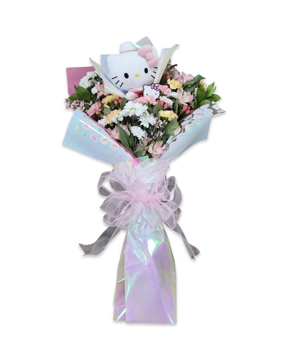 Kitty Crush - This sweet bouquet features soft pastel flowers and fresh greenery, beautifully wrapped with a Hello Kitty plush for an extra cute touch. It does not come with a vase. The stems will be wrapped in a moisture-retaining sponge to help keep the flowers fresh for a few hours until they can be placed in water at home. Perfect for a fun and thoughtful gift. 