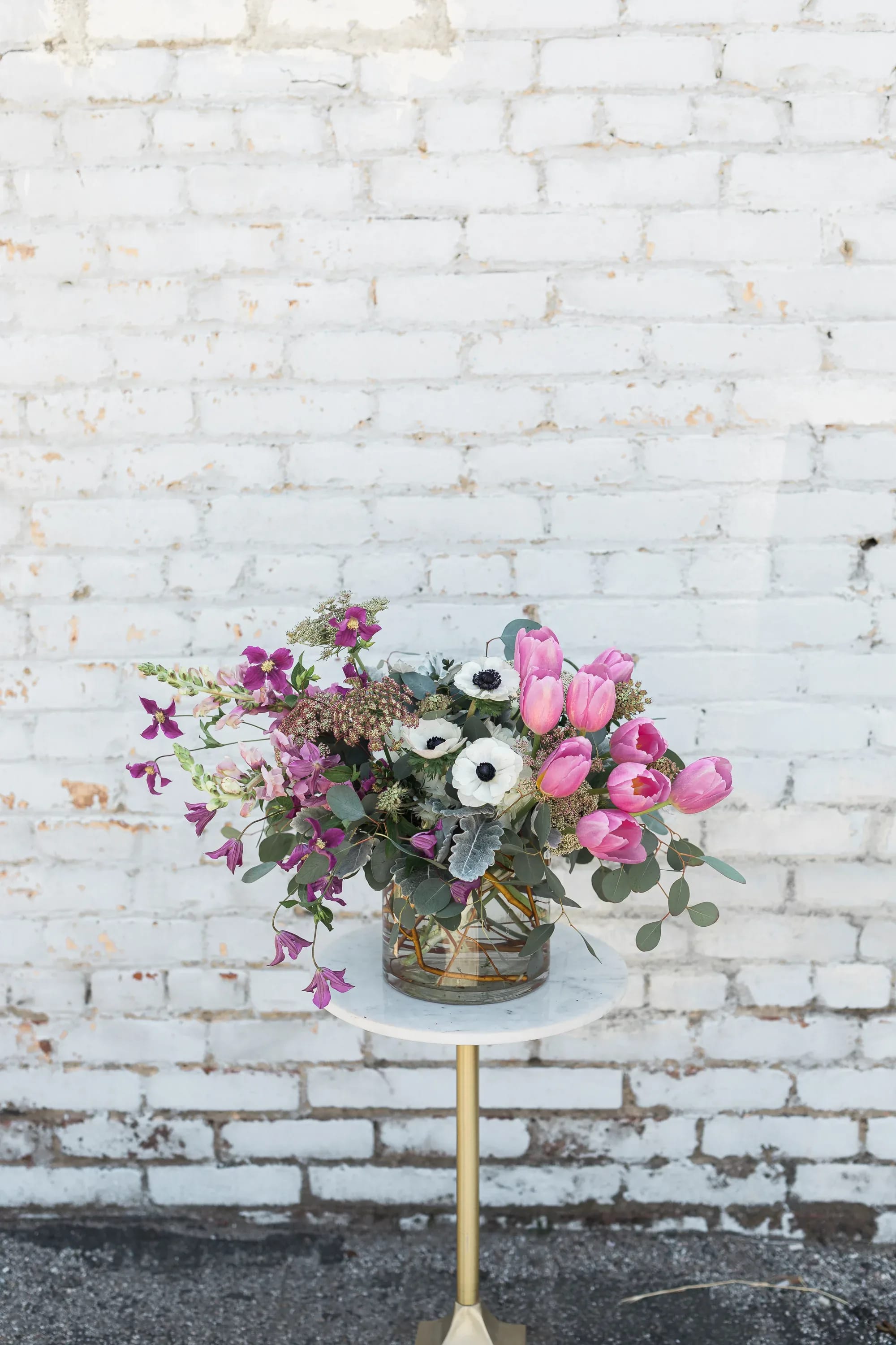 Coco - Celebrate your favorite women this Mother’s Day; perfect for your Mother, Wife, Grandma, Aunt, Sister, and Motherly Figures. Coco comes arranged with a stunning mix of gorgeous premium blooms and textures, all eloquently designed in one of our hand-picked designer vases.  Pictured is [DELUXE]  *Some items in this arrangement must be special ordered, please allow 1-2 weeks notice to allow time for arrival of special items, otherwise, substitutions will occur.*