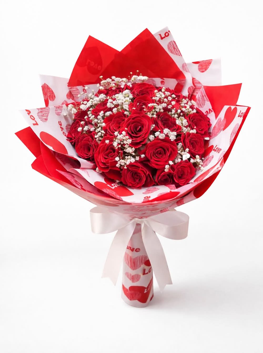 Valentine’s Day Bouquet - Red - Wrapped in love and designed to impress. This stunning bouquet features fresh red roses delicately accented with baby’s breath and beautifully wrapped in romantic Valentine-themed paper. A timeless expression of love, perfect for Valentine’s Day, anniversaries, or simply to say I love you.