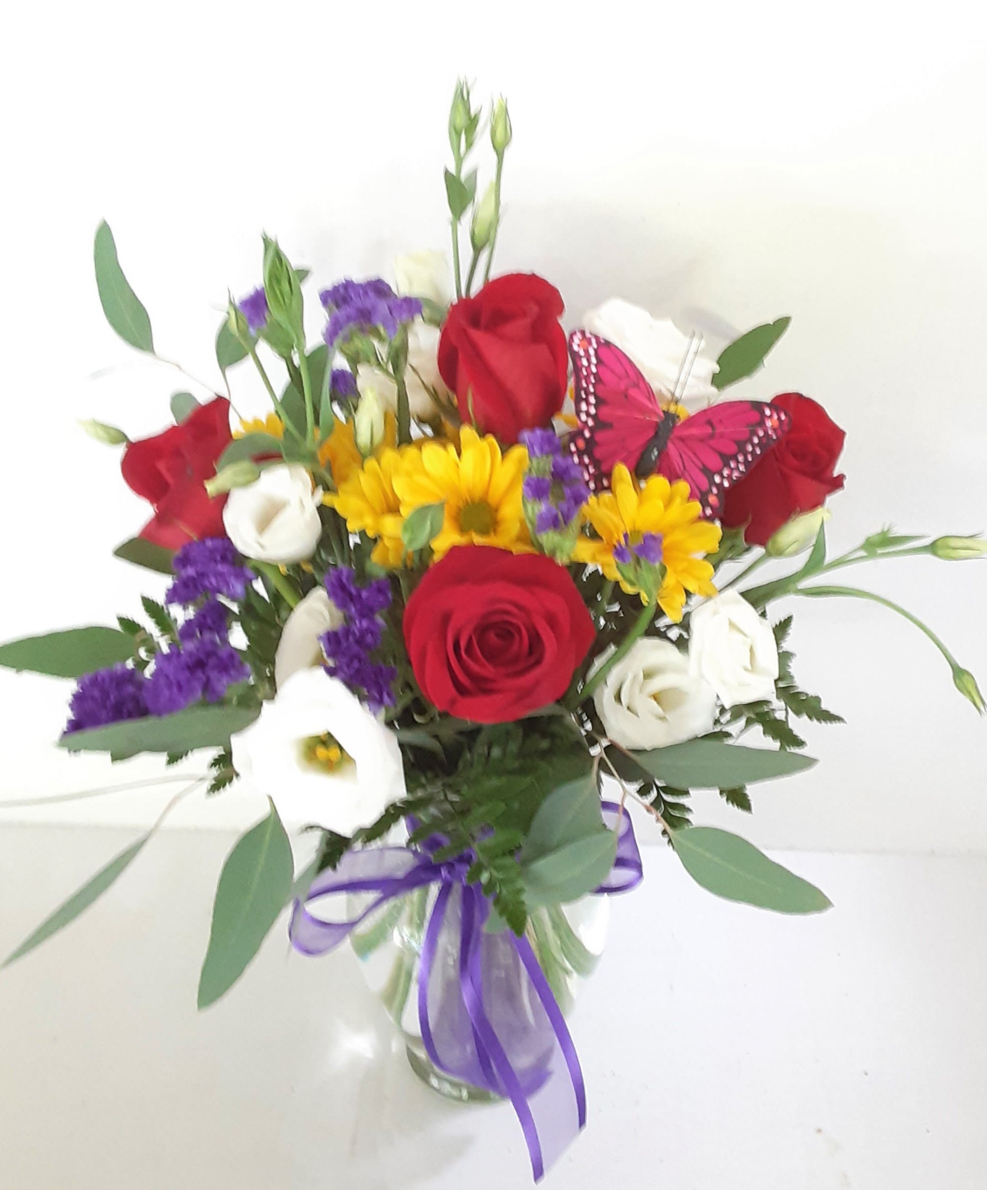 Bright Delight  - A colorful array of roses, daisies, a butterfly and more!