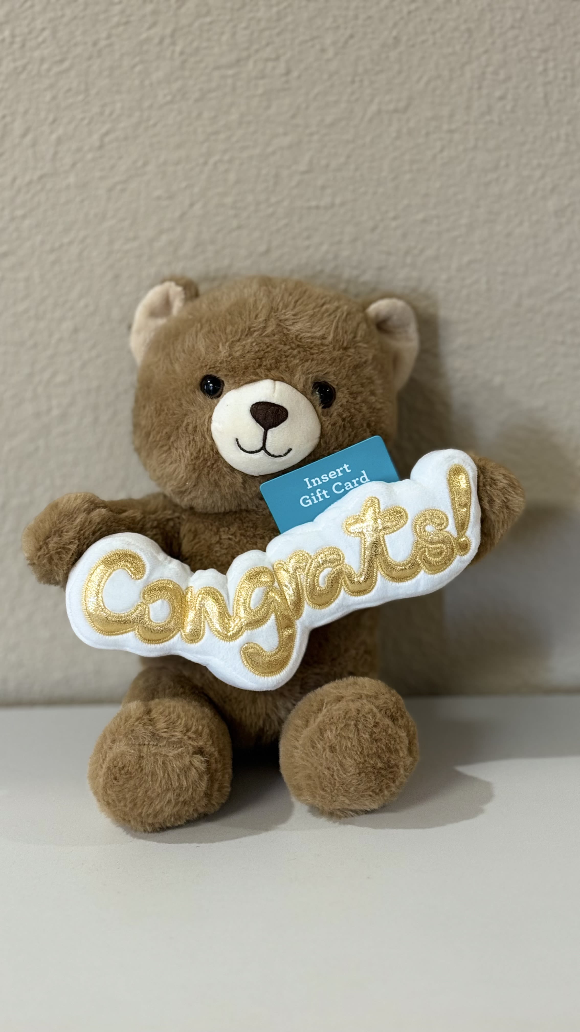 Congrats  Gift Card Bear  Holder - This soft and cuddly Teddy bear holds a special spot for your gift card, making your message with your flowers sweeter. Perfect for graduations, promotions, new beginnings, or any moment worth cheering for. 