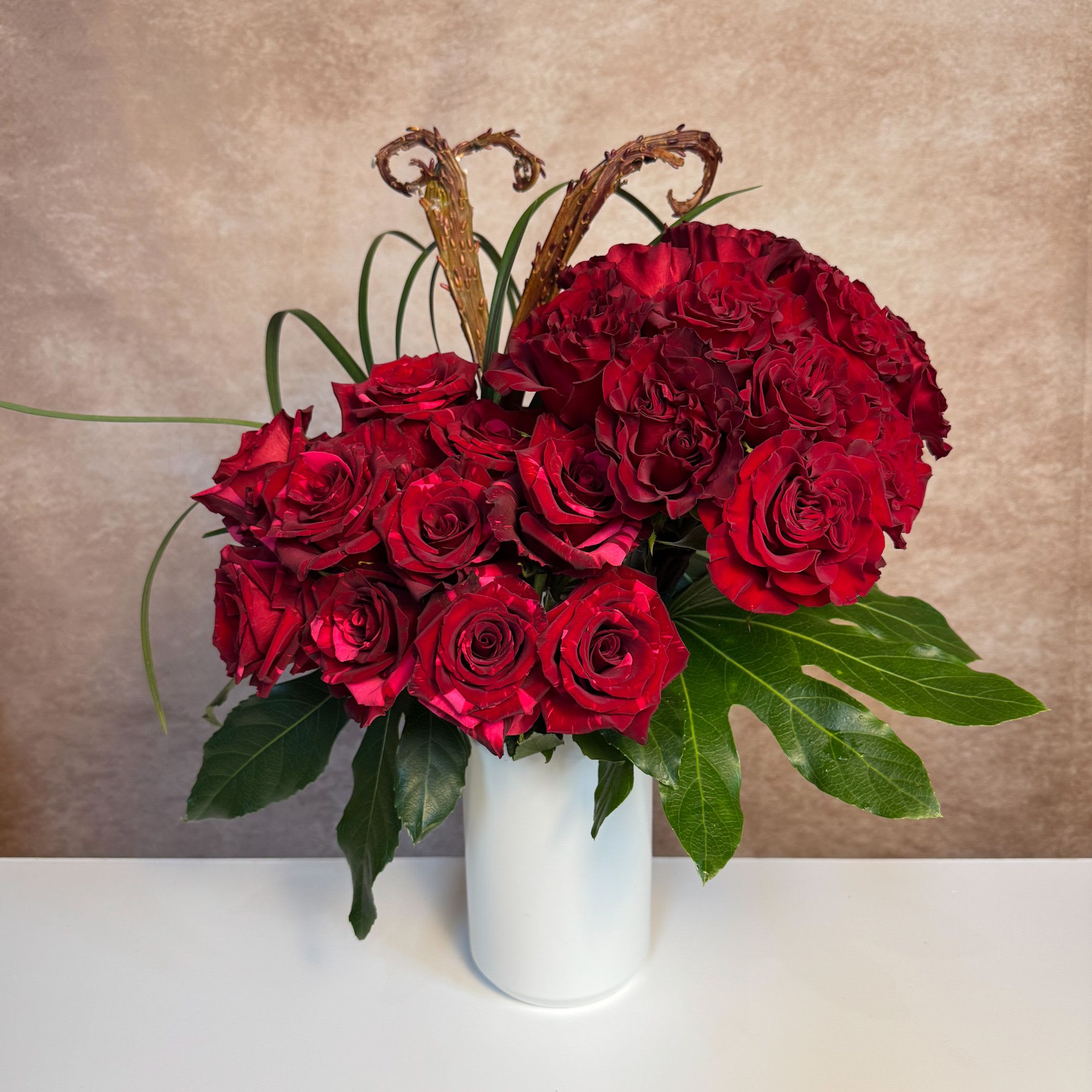 The One and Only - A larger version of our Modern Love arrangement, this showstopper includes two dozen roses.