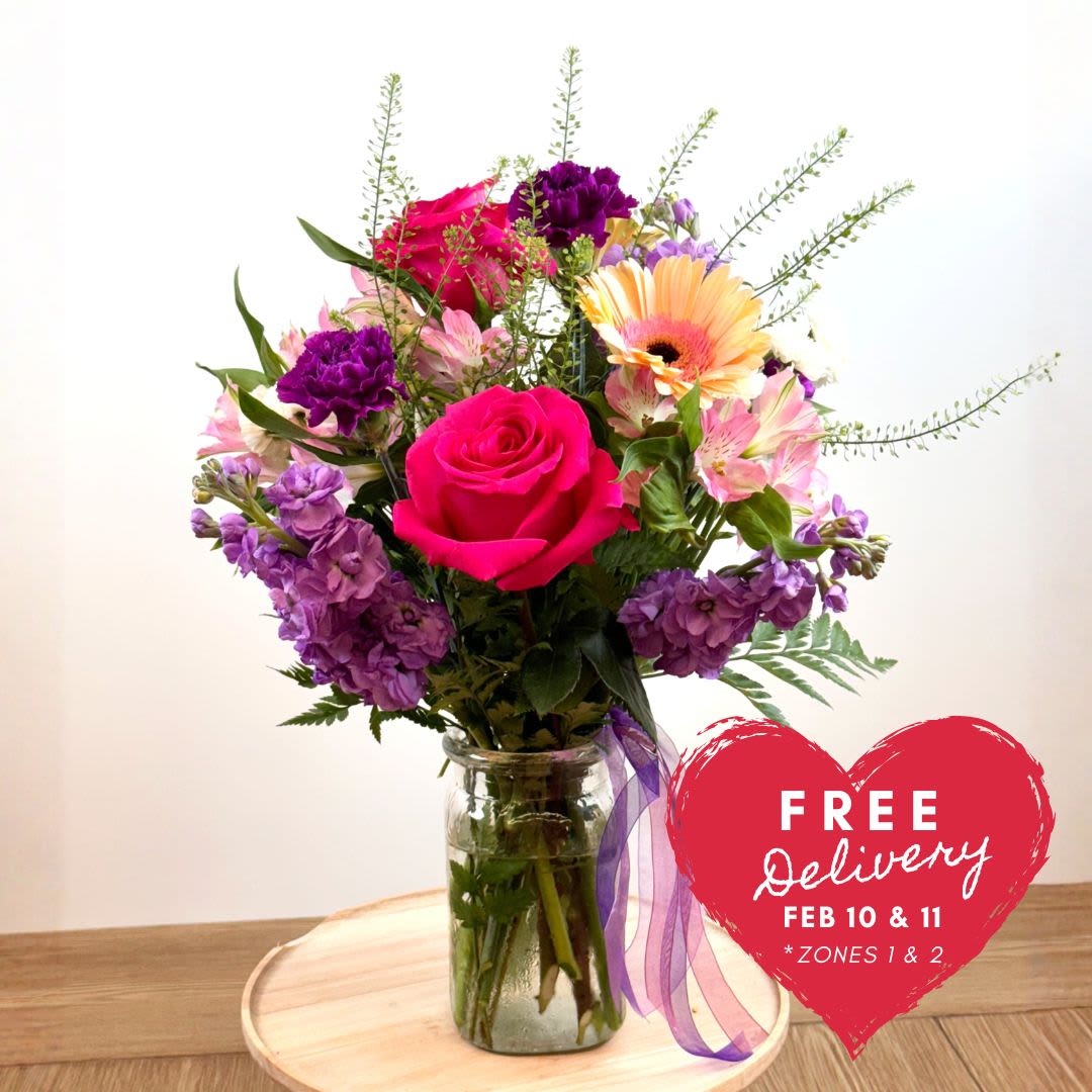 Be Mine Arrangement (Available Feb. 7th) - Brighten someone’s day with this beautiful array of seasonal flowers, perfect for celebrating any occasion or simply bringing a heartfelt smile.  This charming arrangement features vibrant Gerbera daisies, classic carnations, and elegant roses, thoughtfully designed to create a fresh and eye-catching display.  Availability &amp; Ordering Details:  Delivery available: February 7th – February 12th  In-store pickup available: February 13th &amp; 14th  This arrangement is a thoughtful way to share joy, warmth, and appreciation during the season.  Pre-order early to ensure availability for your preferred date. 