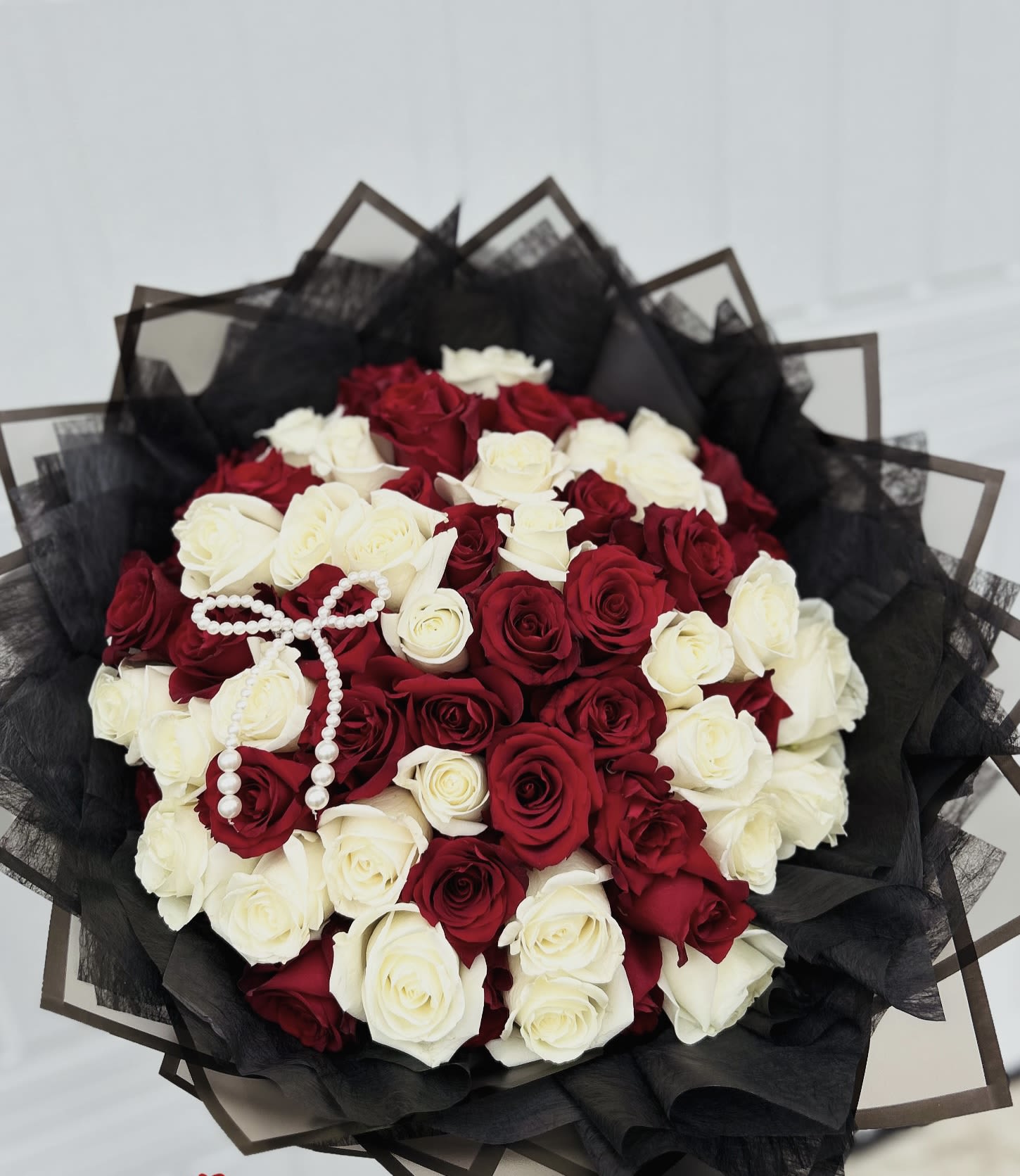 Red and white hand bouquet. - 45 red and white roses with nice wrapping.. Note: Any wrapping colors available.
