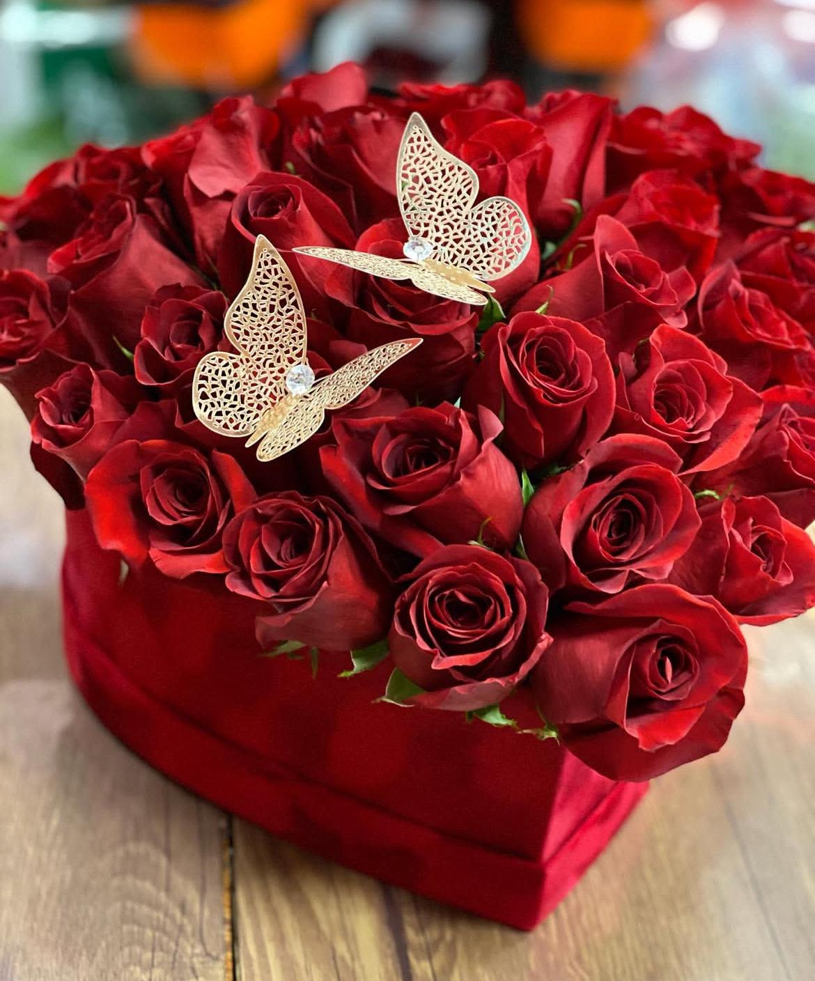 Red Velvet - In some instances, our photo may represent an overall theme or look and include a one-of-a-kind vase which cannot be exactly replicated.  Although the actual bouquet may not precisely match the photo, its temperament will. Occasionally, substitutions of flowers and/or containers happen due to weather, seasonality and market conditions which may affect availability. If this is the case with the gift you’ve selected, we will ensure that the style, theme and color scheme of your arrangement is preserved and will only substitute items of equal value or higher value.  If any design elements are of major importance to your order, please include them in the florist instructions at checkout or contact us to ensure availability.