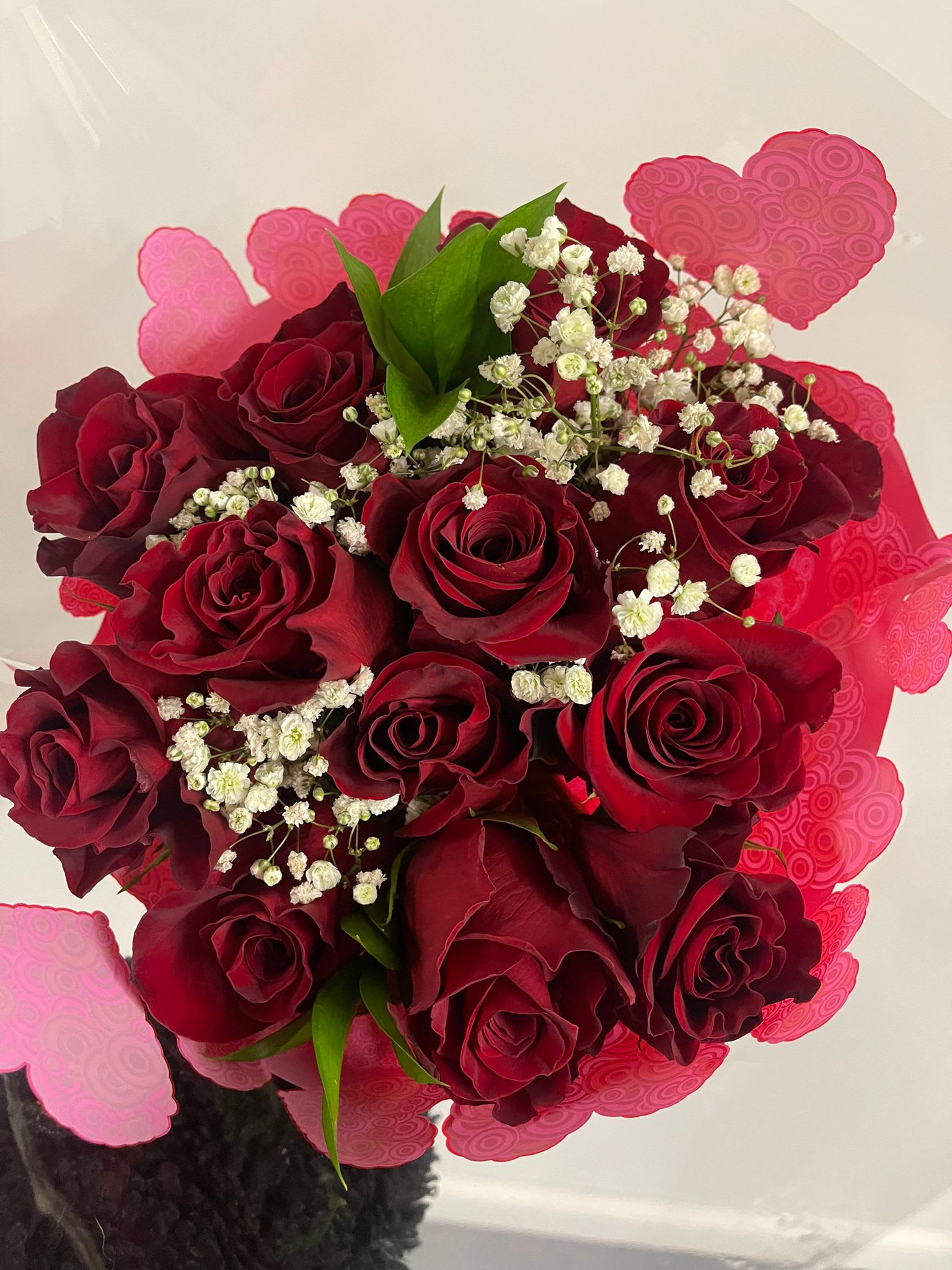 The dozen Red Roses bouquet. - 12 long premium red roses all arranged just ready for you to put it in your own favorite vase.