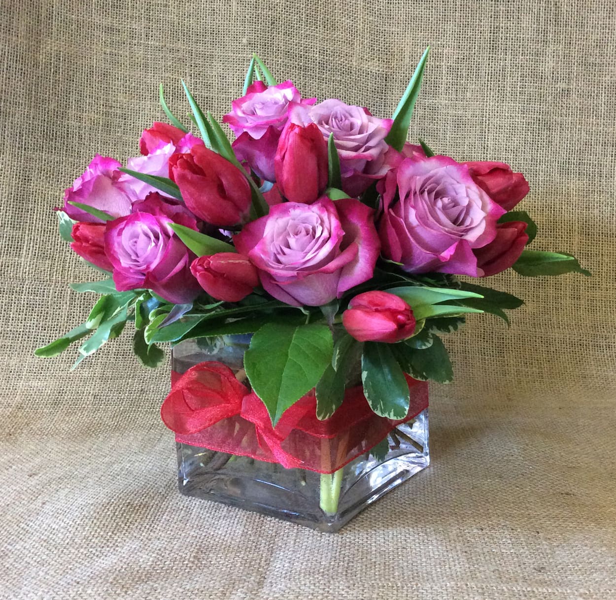Compact Blooming Delight by Kokee - Romantic and modern combination of lavender, pink and red Roses &amp; Tulips.  Other color combinations available upon inquiry. 