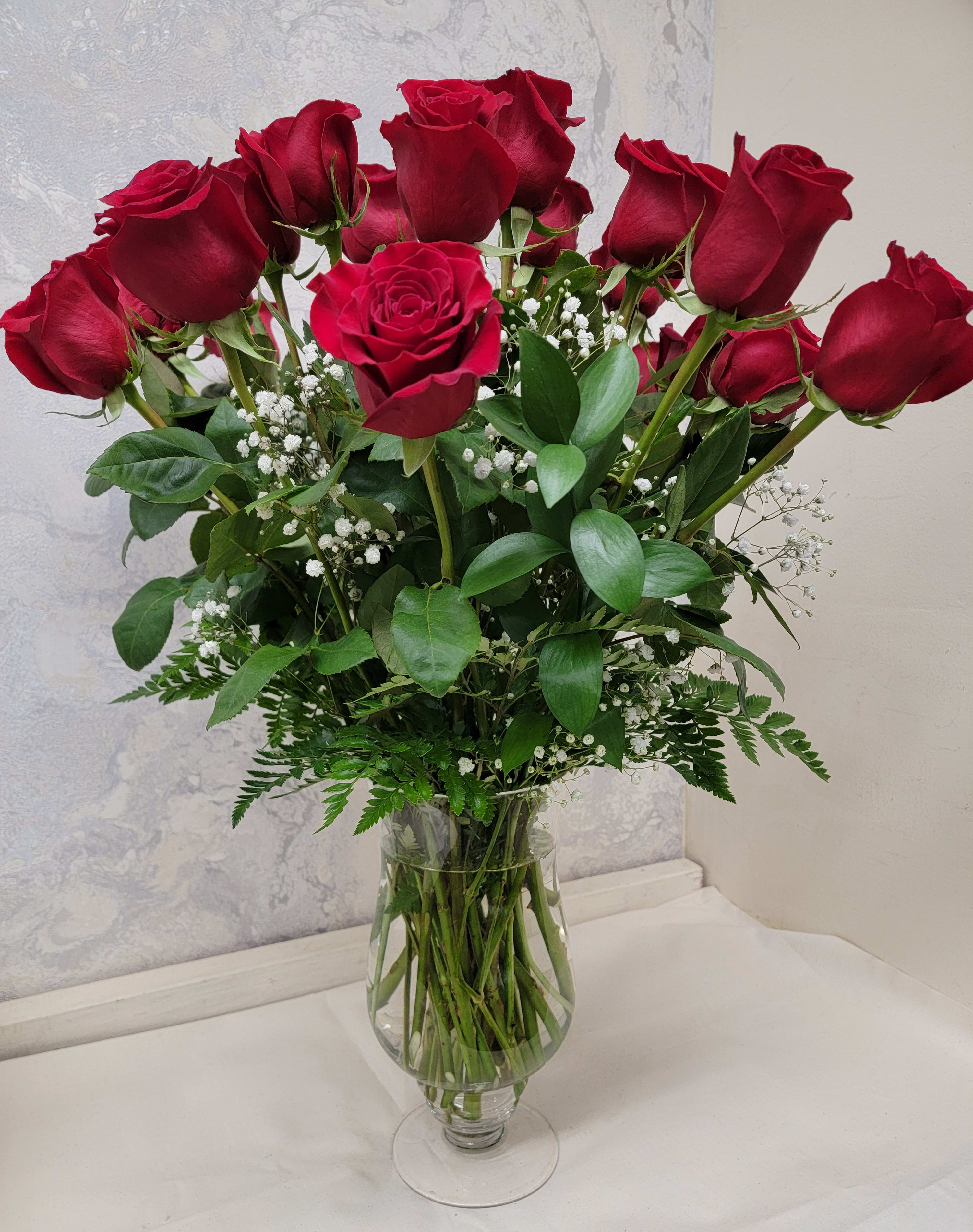 Classic Two Dozen Premium Red Roses - An impressive presentation of two dozen long-stemmed red roses accented with a whimsical filler and greenery. A classic gift for Valentine’s Day, a romantic birthday, an anniversary or as a memorial tribute. It’s a traditional gift that symbolizes love. If you prefer a different color, we have many available. 