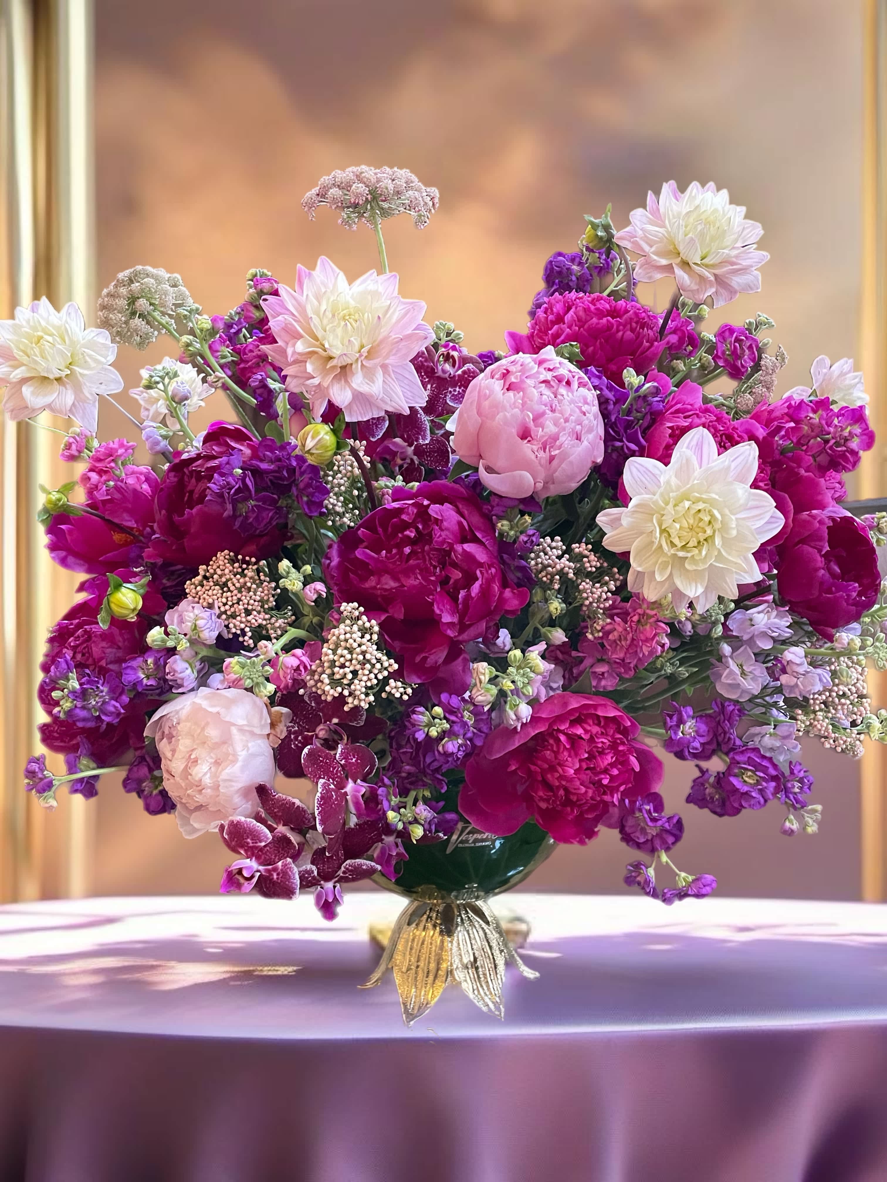 Extraordinary celebration. - Introducing our exquisite floral arrangement for birthday! Bursting with vibrant hues, this stunning creation features a harmonious blend of peonies in deep shades of purple, dark pink, and crystal white. Adding an enchanting touch are the delicate purple orchids, light pink lavender dahlias, and marvelous stock in lavender, magenta, burgundy and purple tones. Truly captivating, this arrangement is a perfect blend of elegance and charm. Delight your senses with this mesmerizing masterpiece, meticulously crafted to bring joy and beauty to your celebration. Order now and make this birthday celebration truly unforgettable!