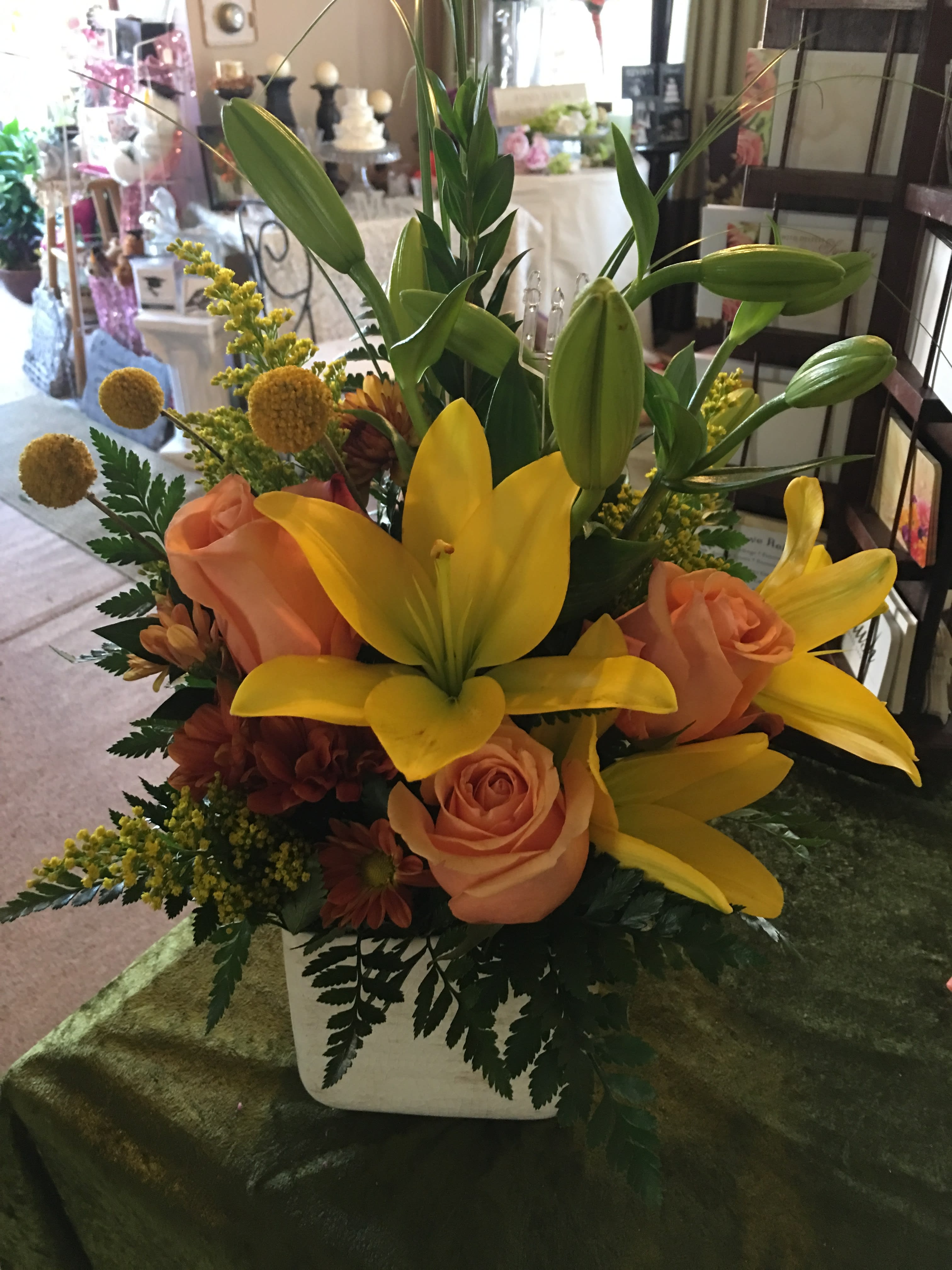 Sunshine and Roses - Yellow Lillies, Peach roses, Solidago,and assorted greens