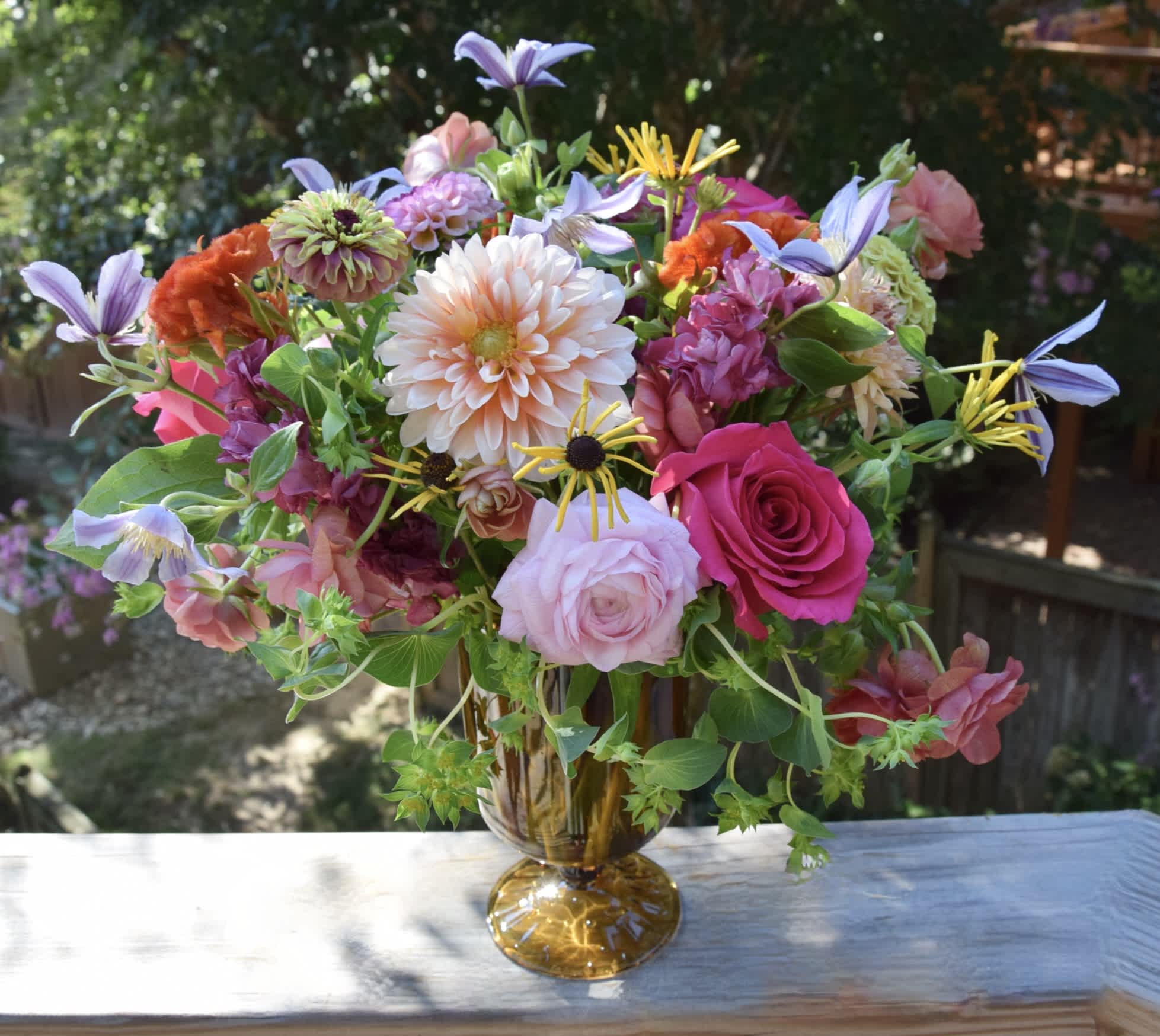 Seasonal Beauty  - A vase filled with fresh seasonal and mostly locally grown flowers arranged by Michaela in a garden/wild flower meadow style. The colors and selection of flowers may vary based on the availability.