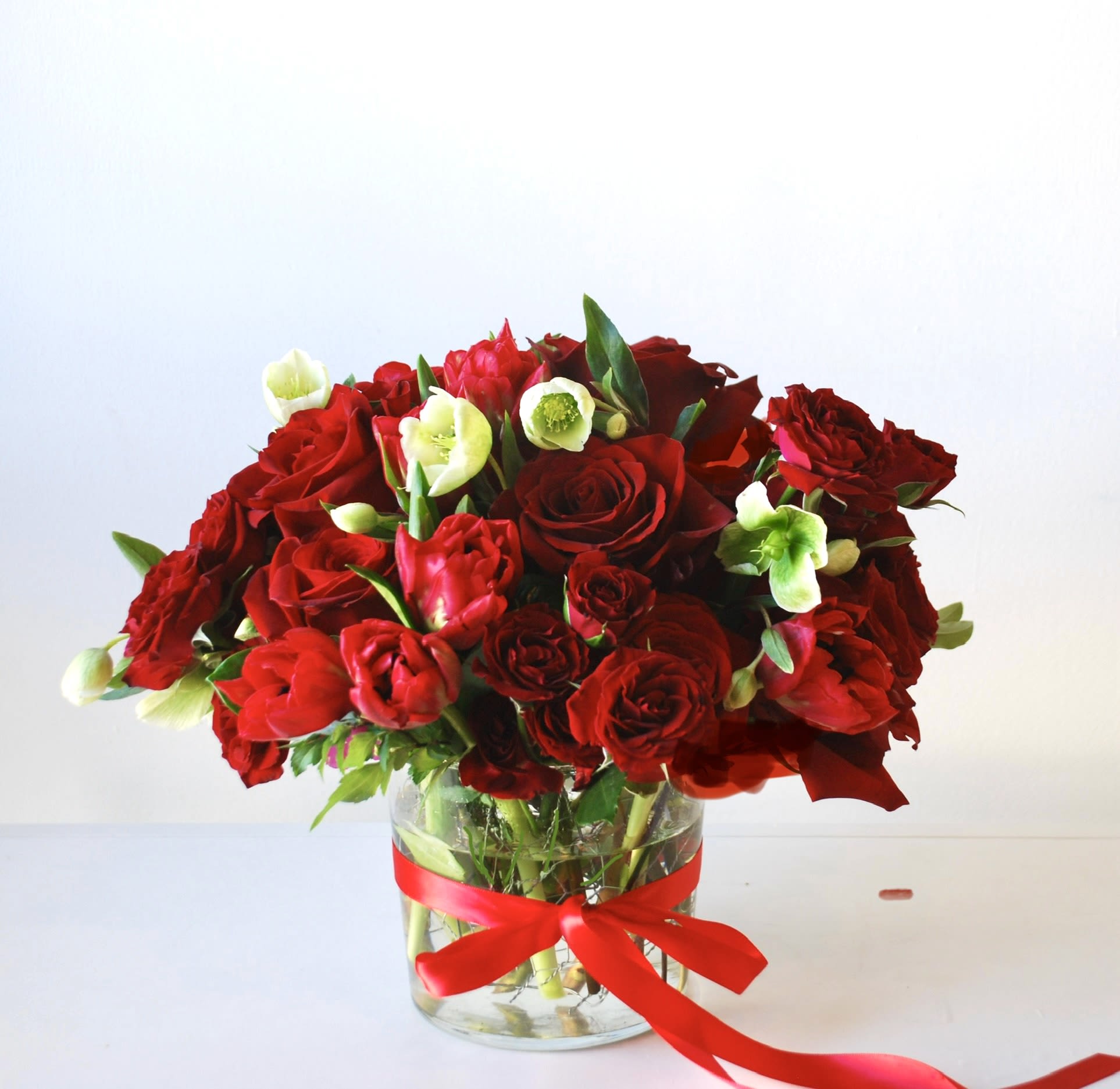 Romeo - Classic of classic with a touch of green. Red roses, red spray roses, red tulips.  