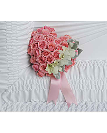 Divine Serenity Casket Insert - A heartfelt tribute to your love, this sweet pink rose heart is adorned with delicate white orchids for an uplifting casket arrangement. White dendrobium orchids and pink spray roses are accented with dusty miller and light pink ribbon.