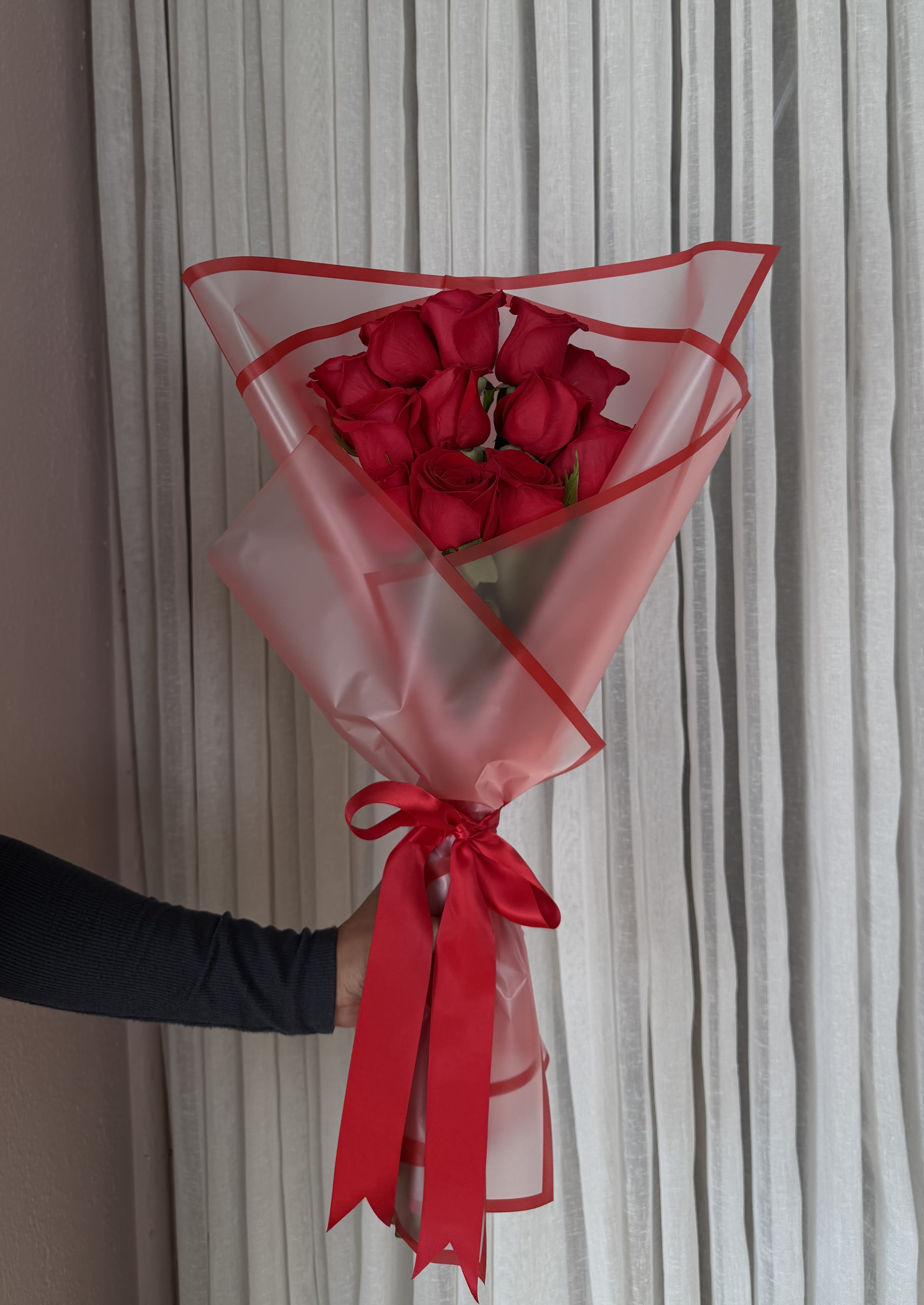 Dozen Red Roses Wrapped  - Dozen Red Roses carefully wrapped and tied with a satin ribbon.   Default colors as shown, please request a different color at checkout. 